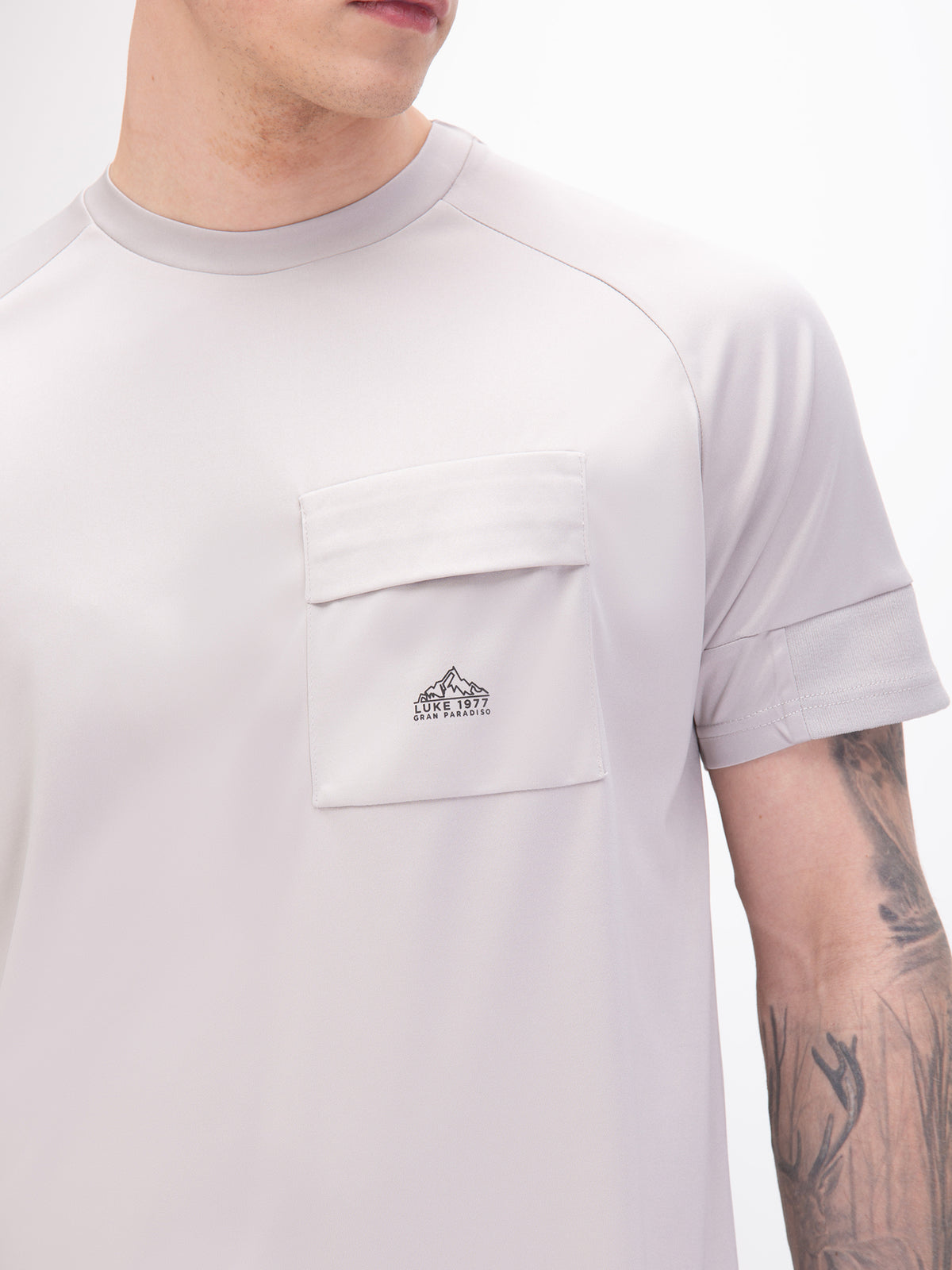 Men's grey t-shirt with crew neck and short sleeves, worn by a model