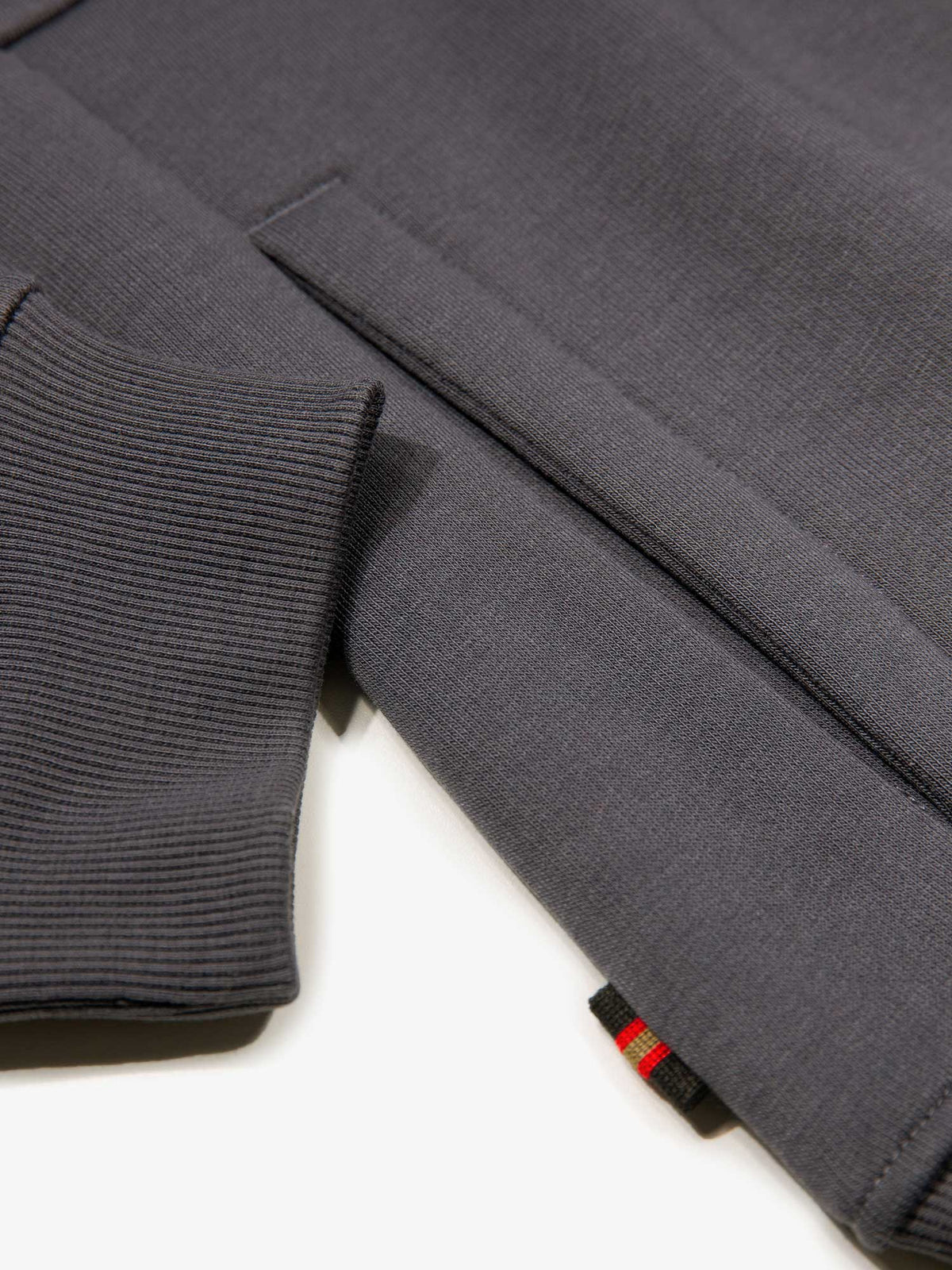 Men's relaxed-fit grey hoodie with front pocket and drawstring hood, detail view 4