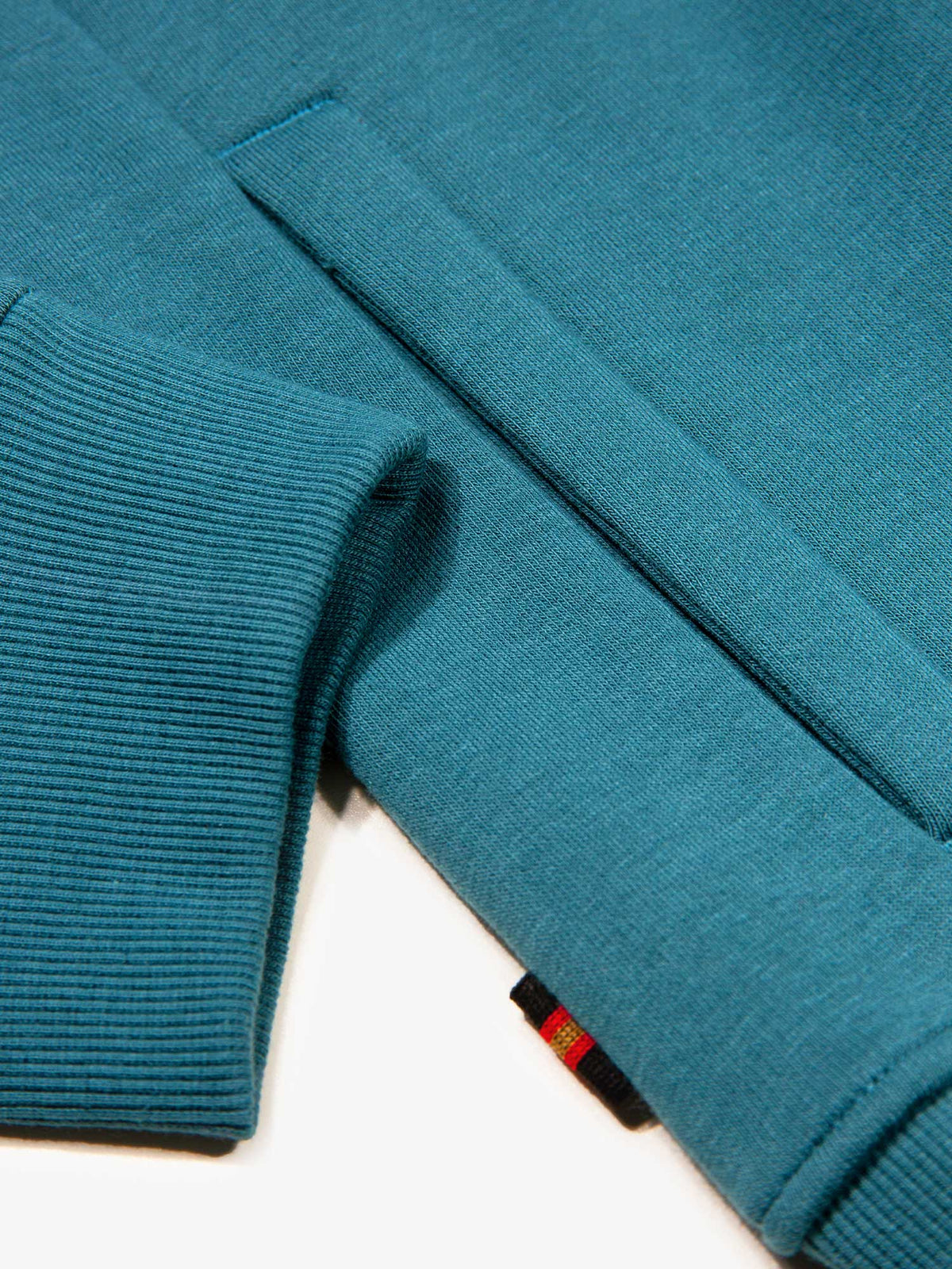 Men's relaxed-fit blue hoodie with front pocket and drawstring hood, detail view 4