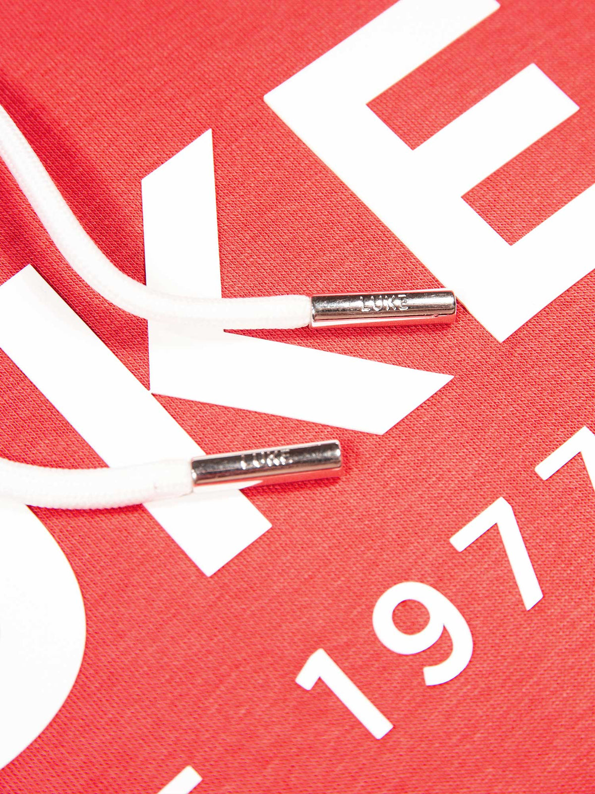 Men's relaxed-fit red hoodie with front pocket and drawstring hood, detail view 3