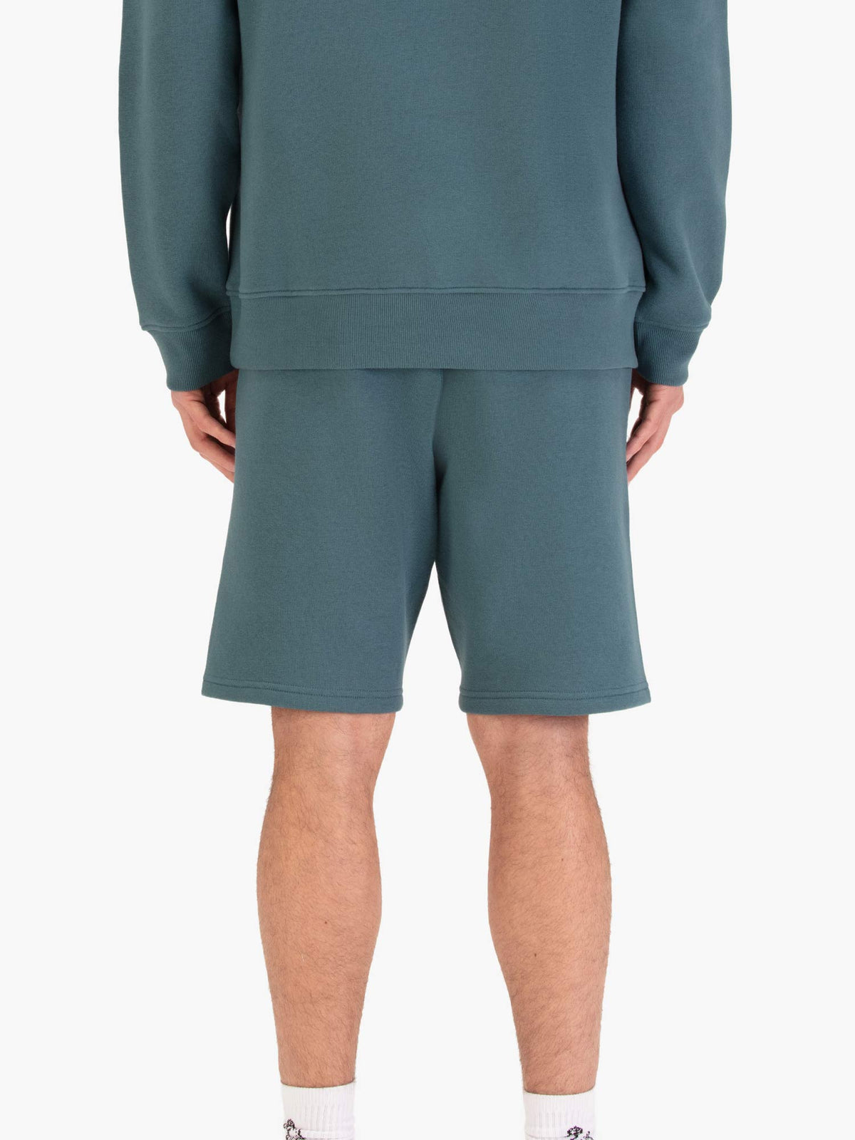 Men's blue shorts with drawstring waistband, worn by a model, back view