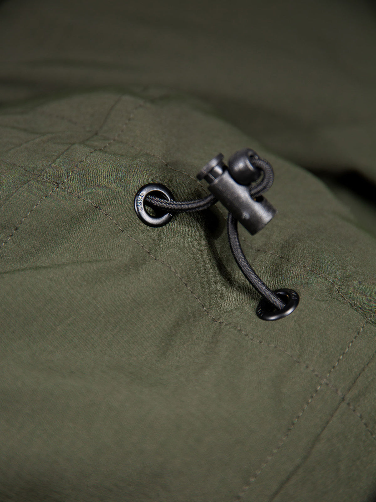 Men's green jacket with zip-up front.
