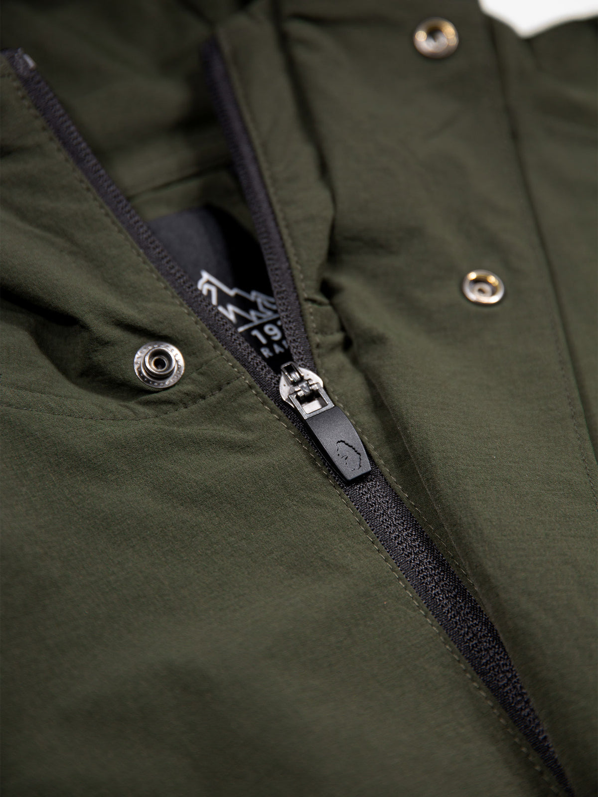 Men's green jacket with zip-up front.