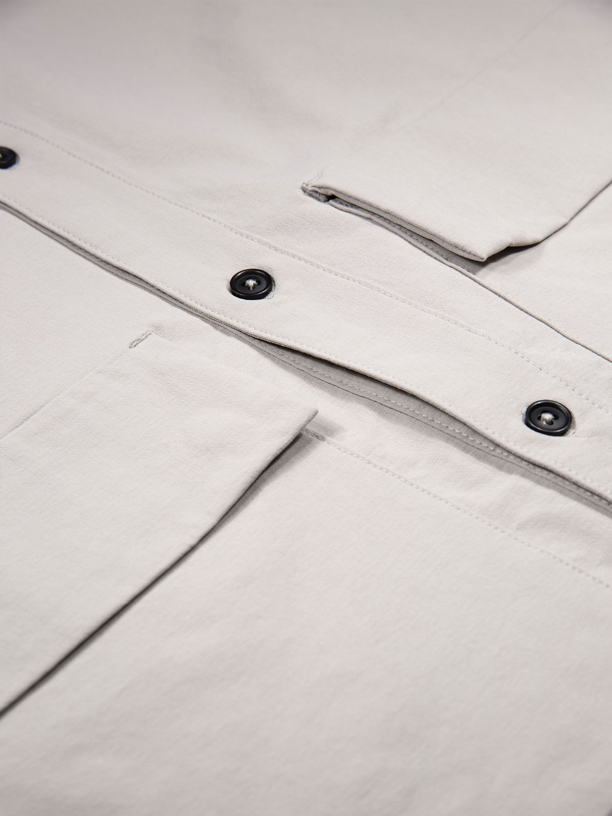 Close-up of snap fastening patch pocket on cement grey LUKE 1977 Canavese shirt