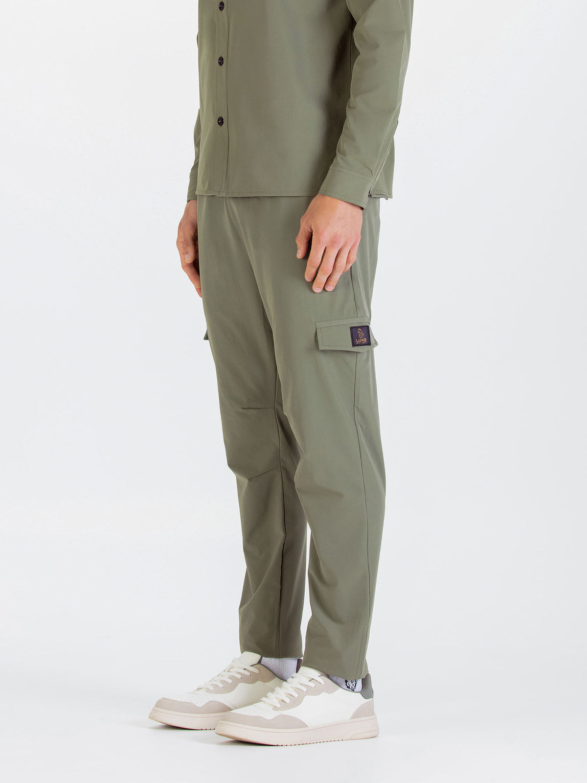 Men's green cargo trousers with cargo pockets.