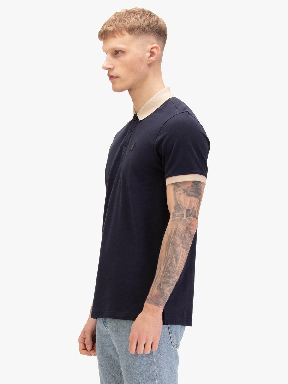 Men's navy polo shirt with polo collar, back view