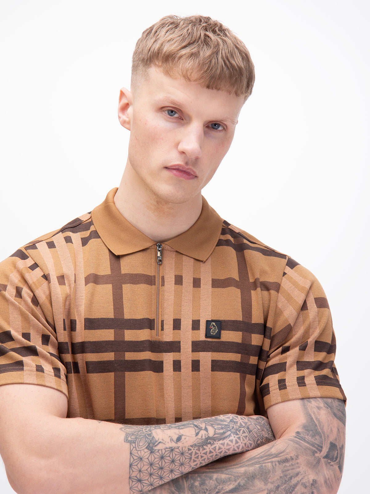 Men's orange polo shirt with polo collar, worn by a model