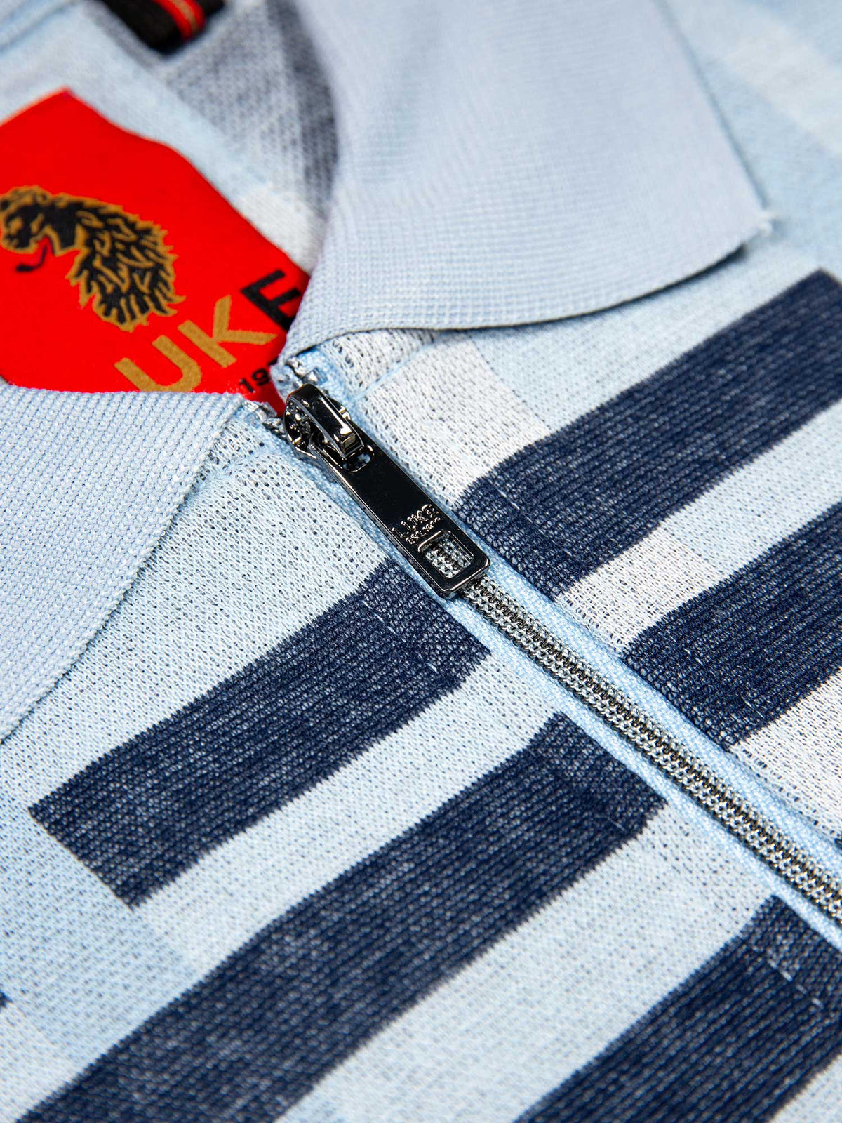 Men's blue polo shirt with polo collar, detail view