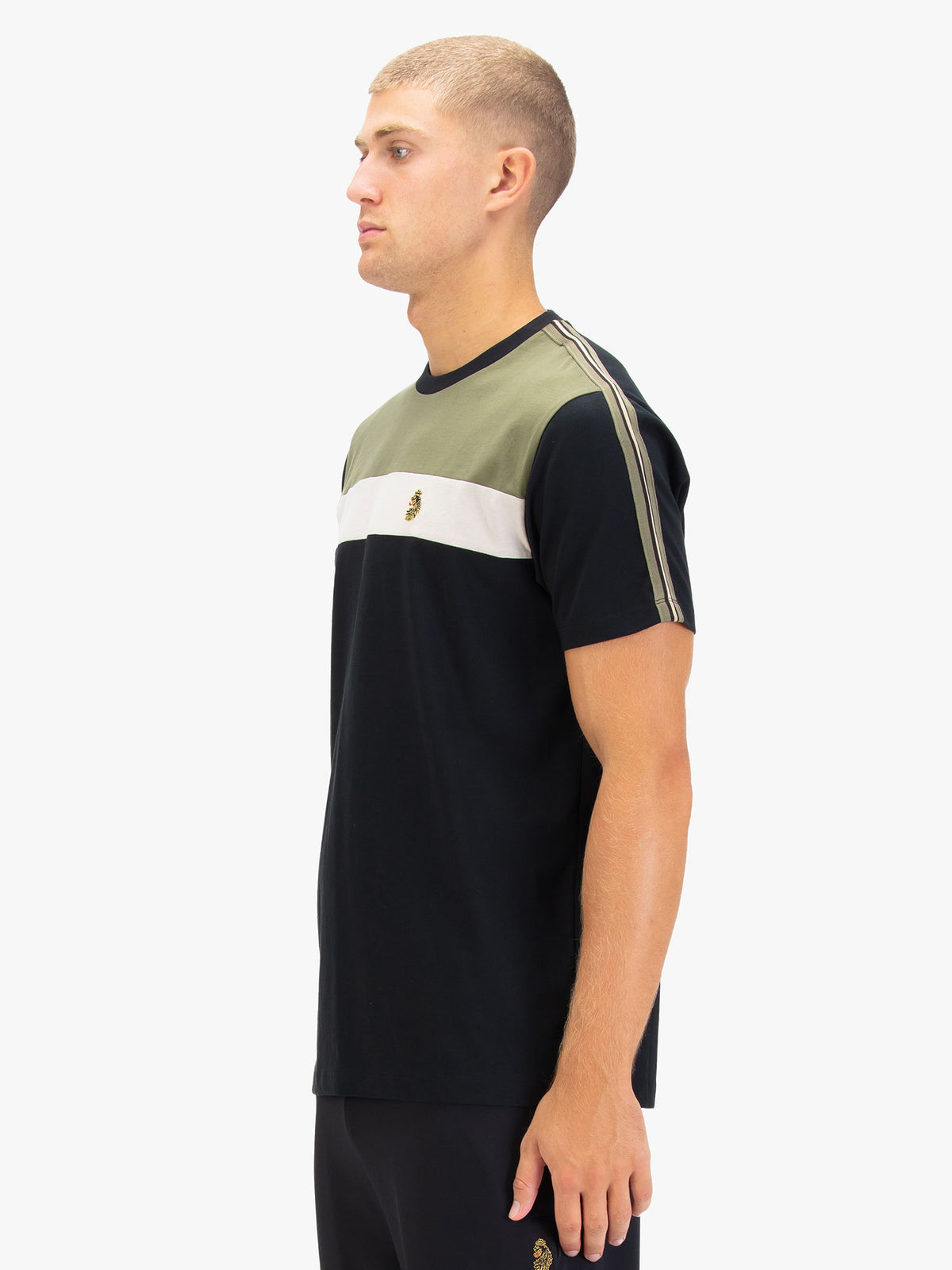 Men's black t-shirt with crew neck and short sleeves, worn by a model, side view