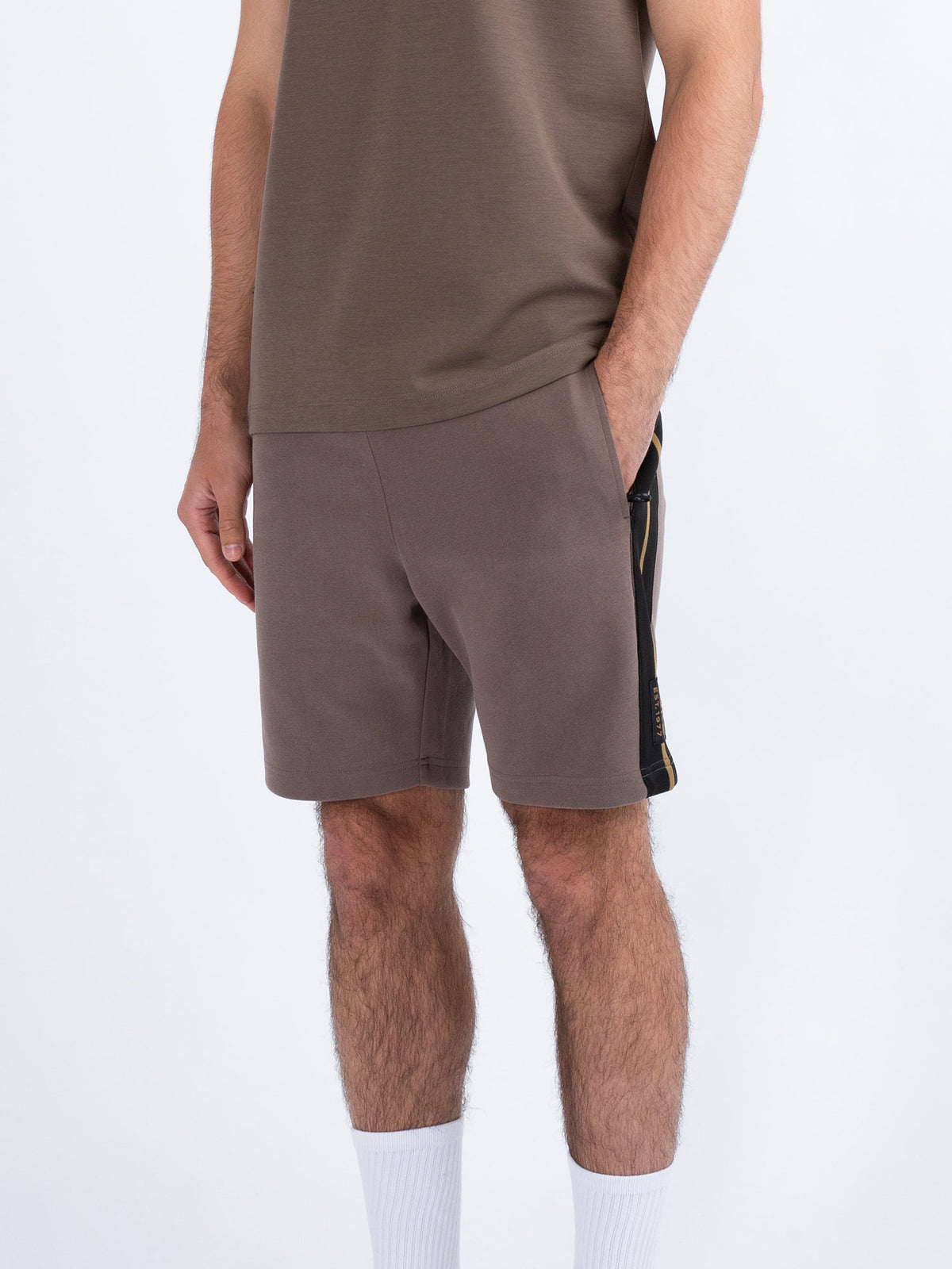 Men's brown shorts with drawstring waistband.