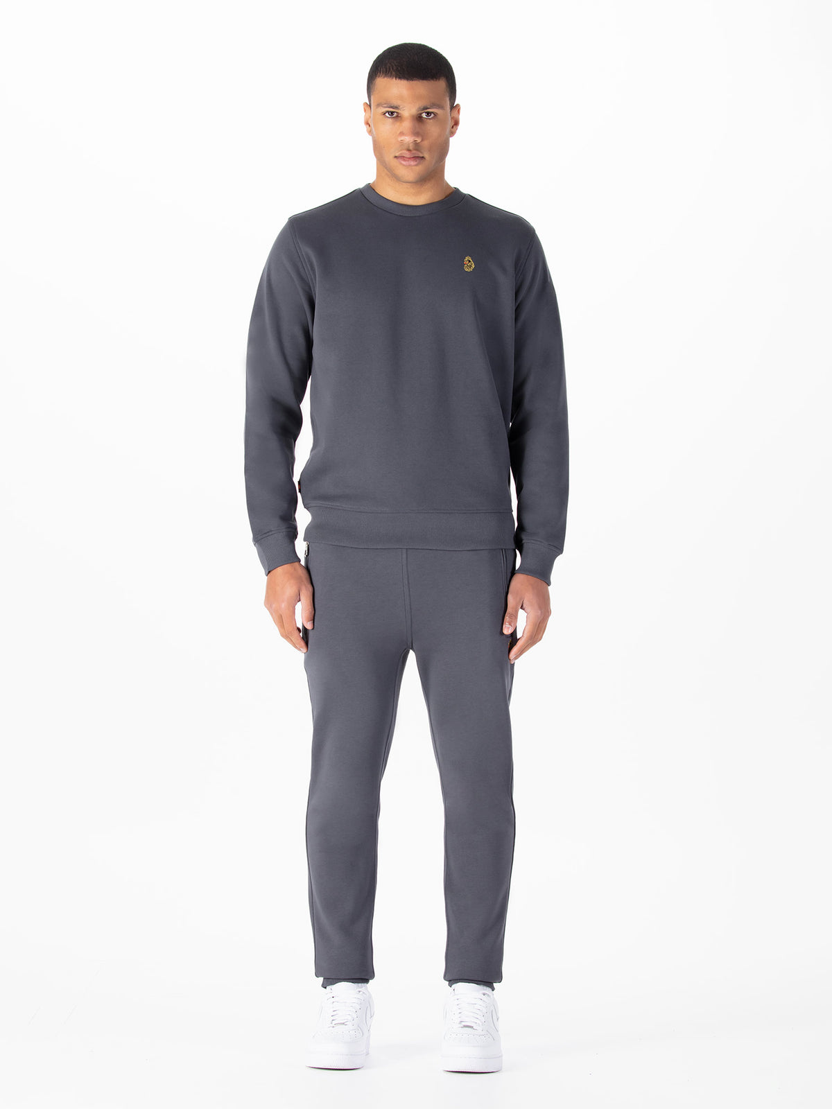 Men's grey tracksuit with crew neck sweatshirt and matching joggers.