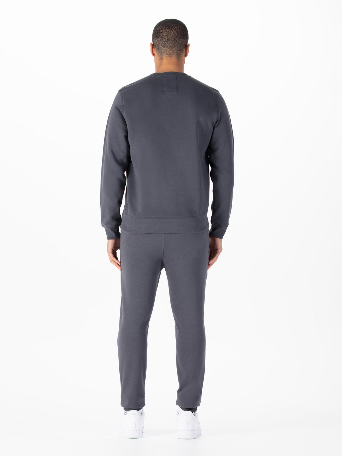 Men's grey tracksuit with crew neck sweatshirt and matching joggers.