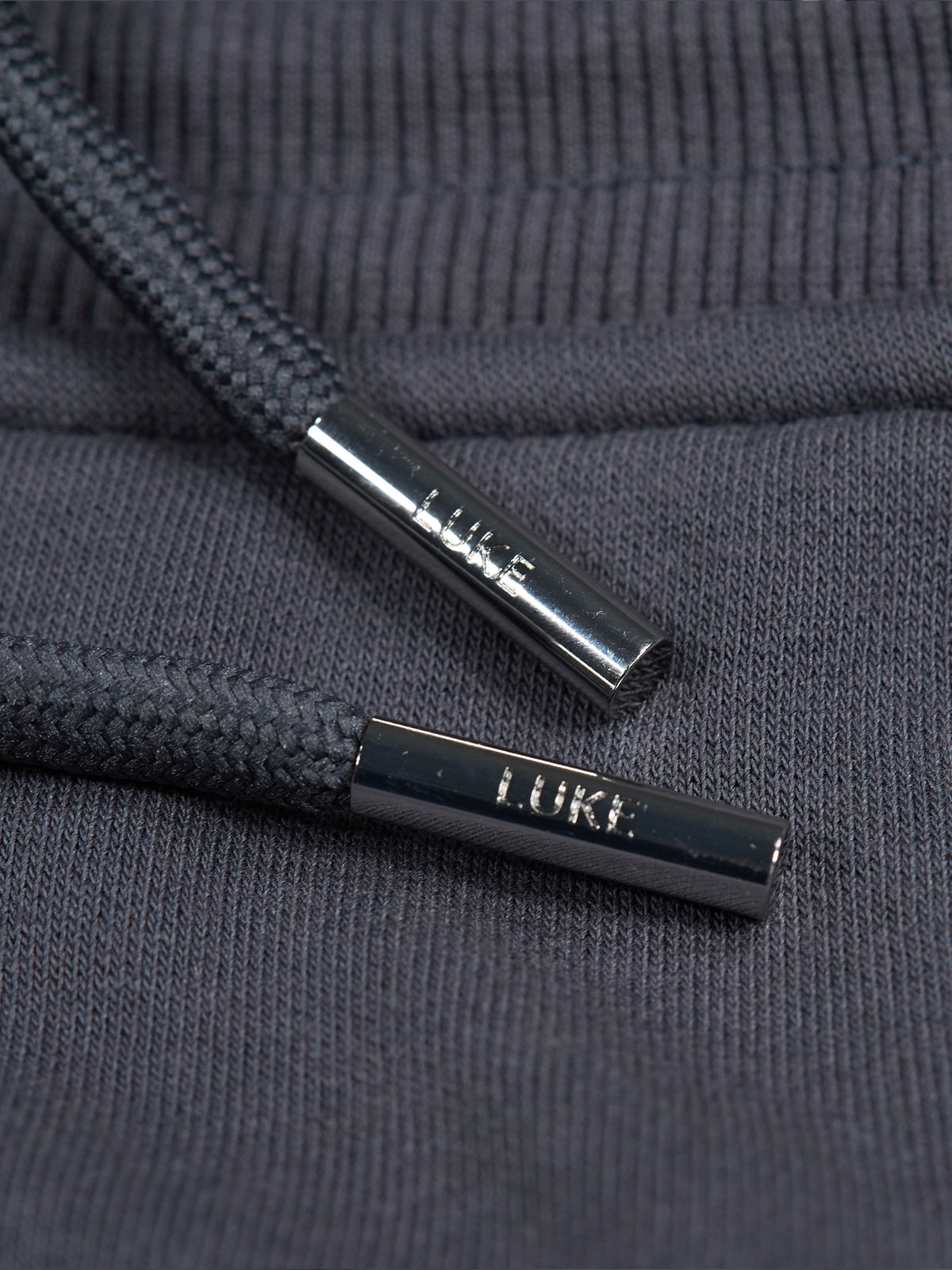 Men's grey tracksuit with crew neck sweatshirt and matching joggers.