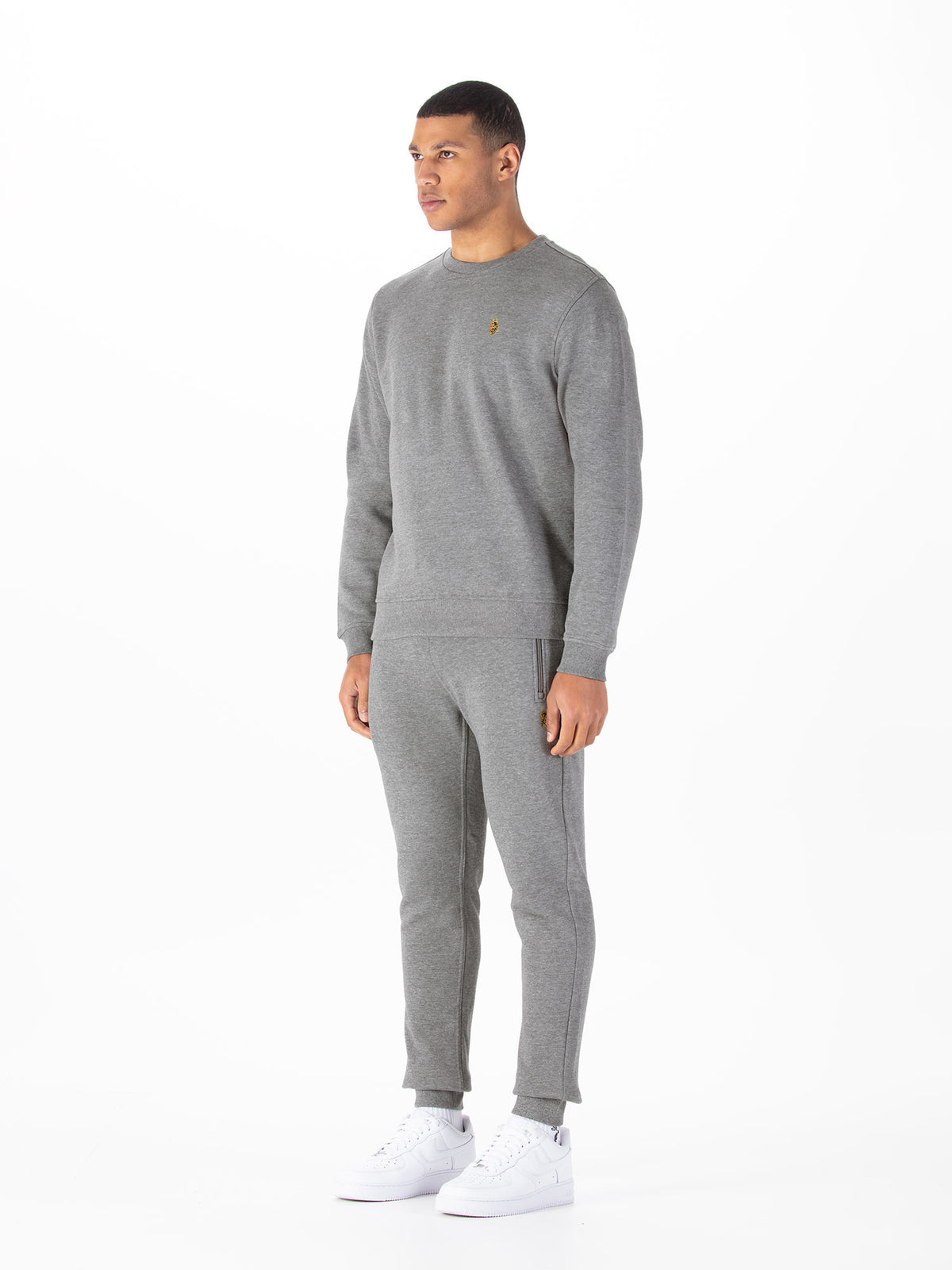 Men's grey tracksuit with crew neck sweatshirt and matching joggers.