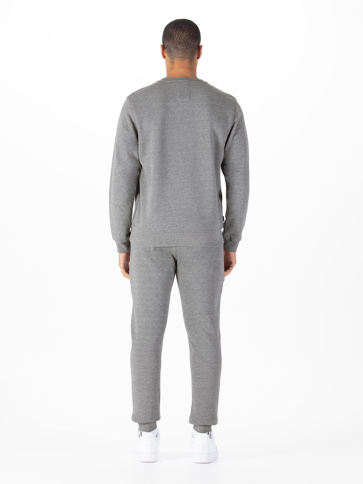 Men's grey tracksuit with crew neck sweatshirt and matching joggers.