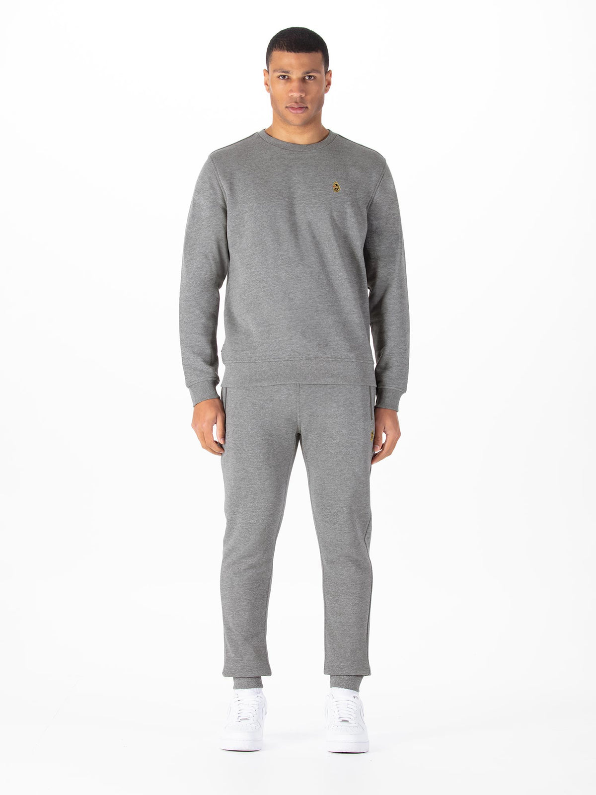 Men's grey tracksuit with crew neck sweatshirt and matching joggers.