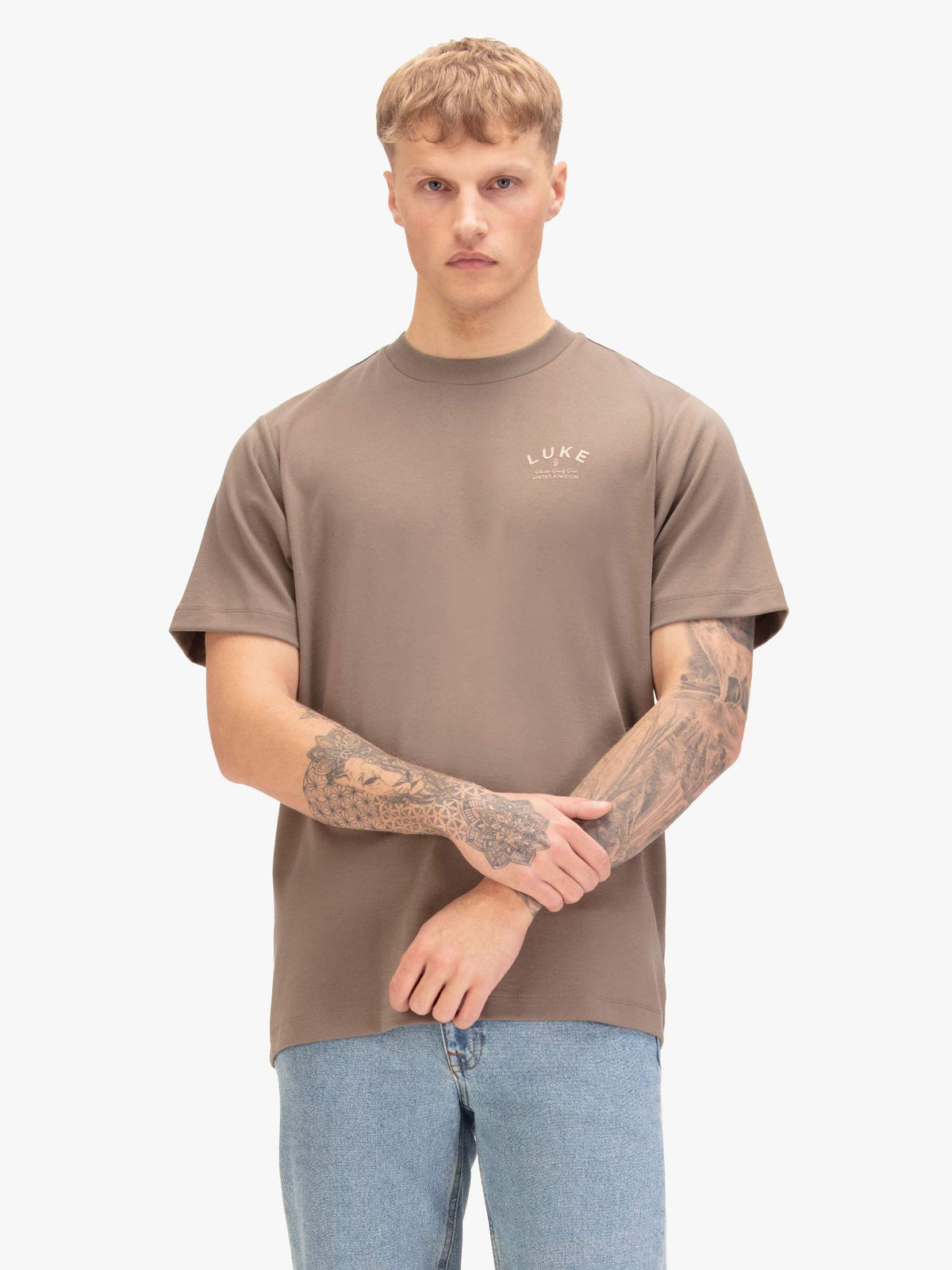 Men's relaxed-fit brown t-shirt with crew neck and short sleeves, worn by a model, front view