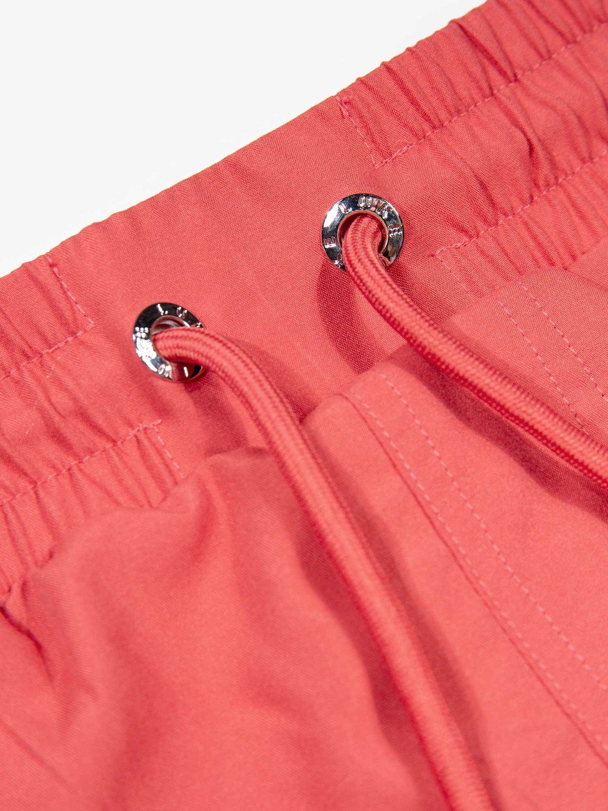 Men's red swim shorts with drawstring waistband, detail view 1