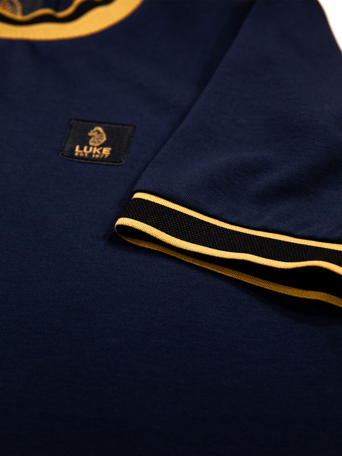 Men's navy t-shirt with crew neck and short sleeves worn by a model - back view.