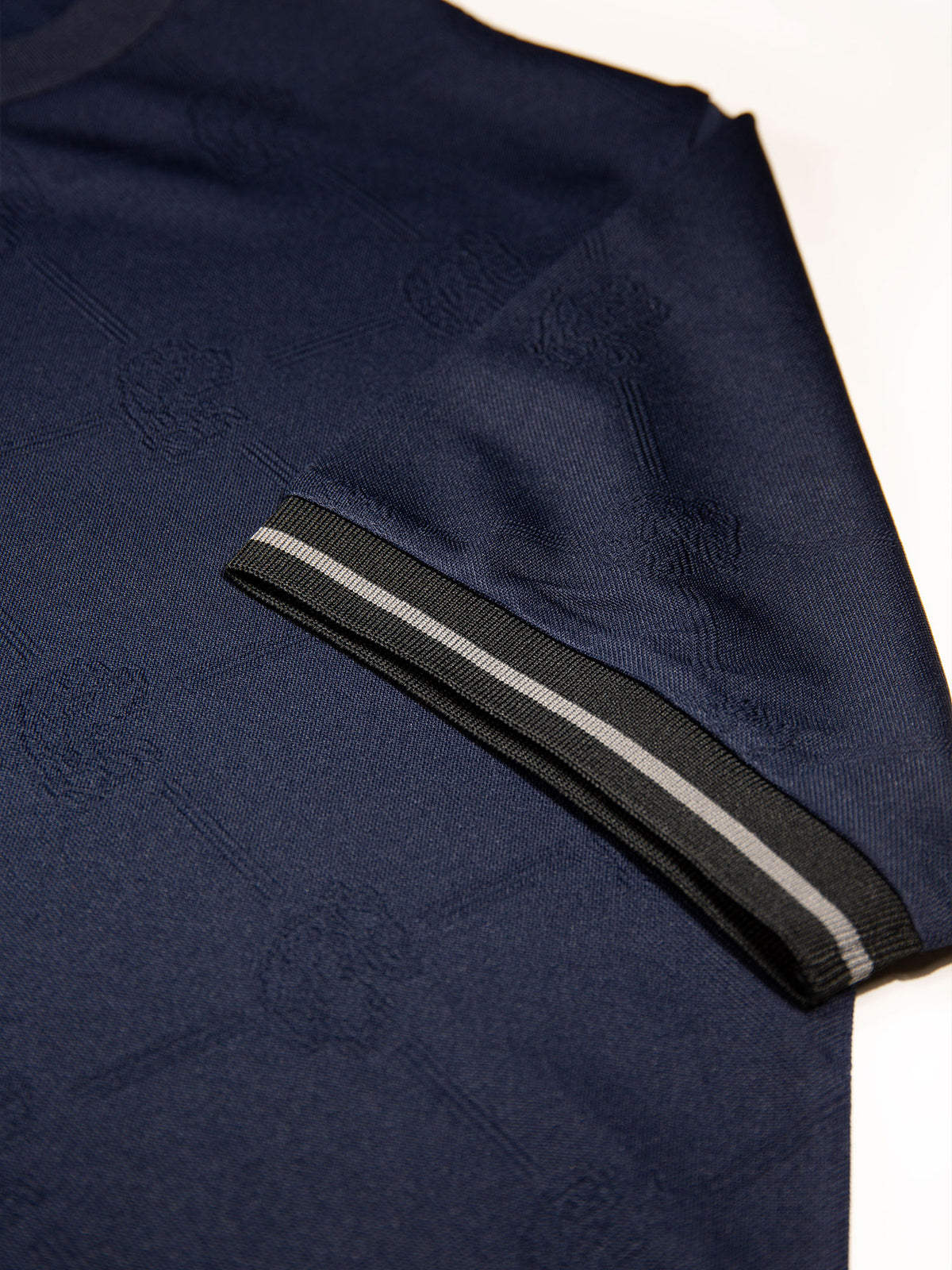 Men's navy t-shirt with crew neck and short sleeves worn by a model - back view.