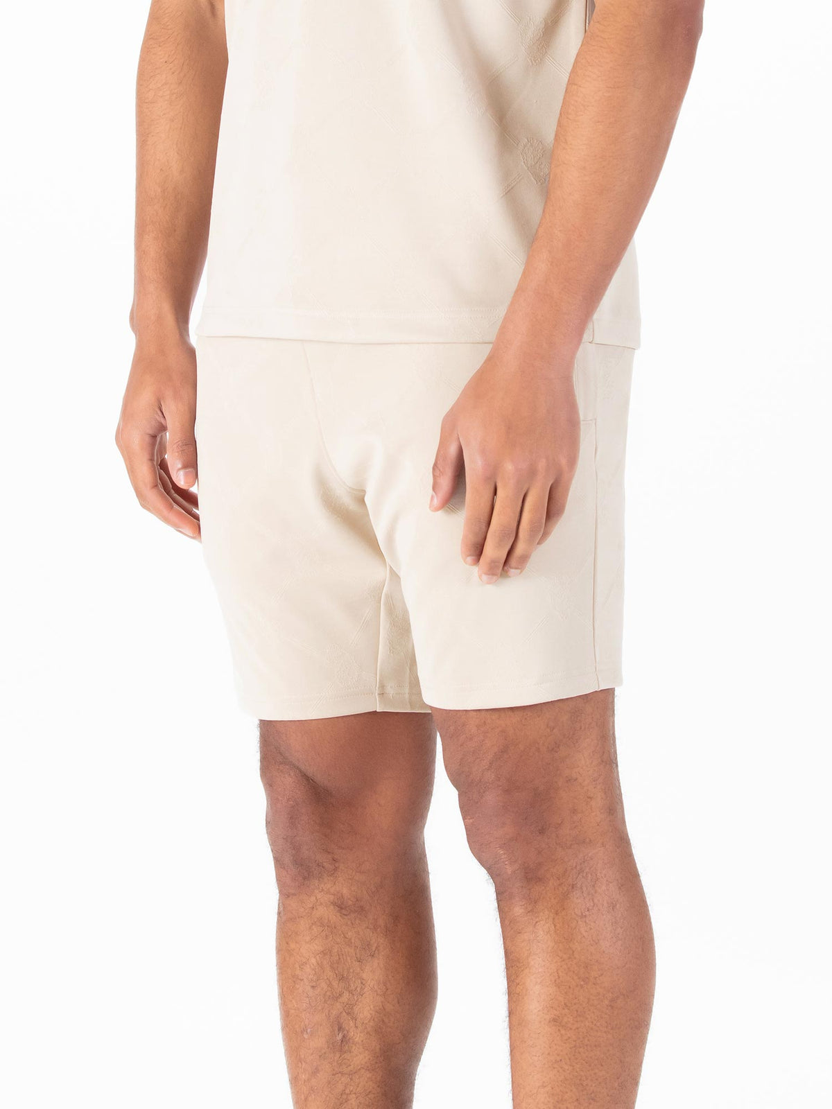 Men's beige shorts with drawstring waistband.