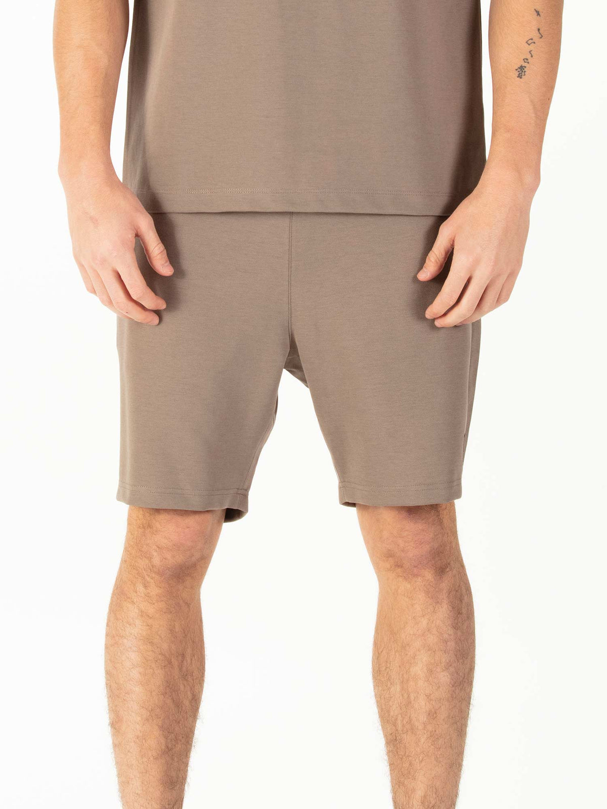 Men's brown shorts with drawstring waistband.
