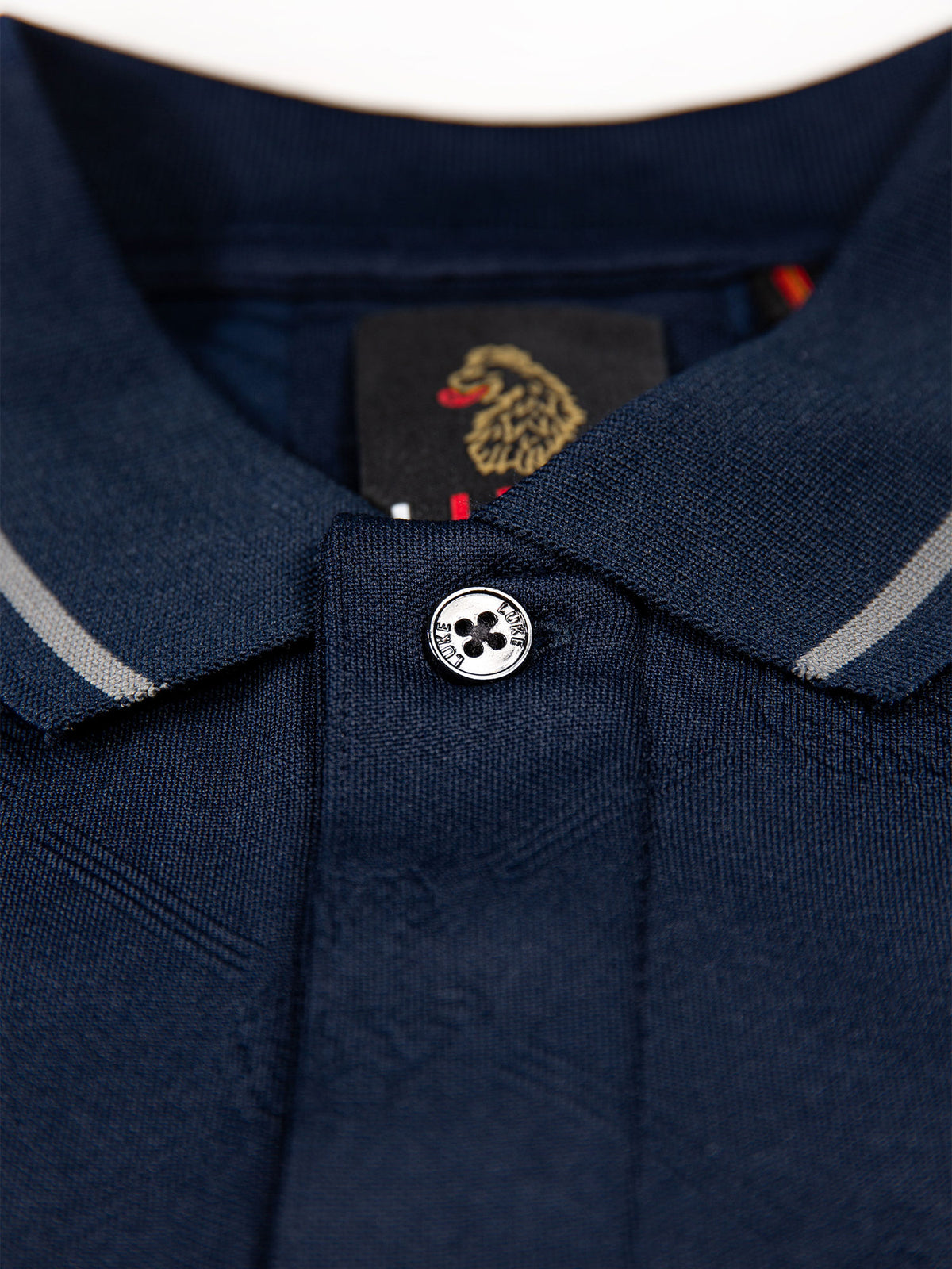 Men's navy polo shirt with polo collar.
