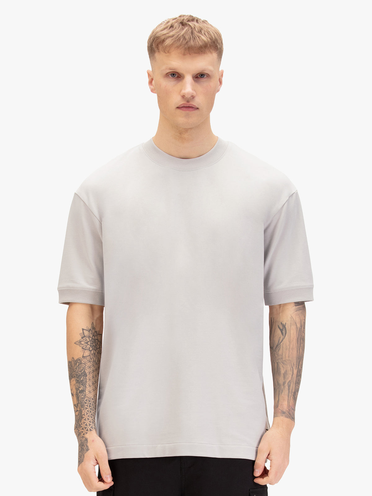 Men's relaxed-fit grey t-shirt with crew neck and short sleeves, worn by a model, front view