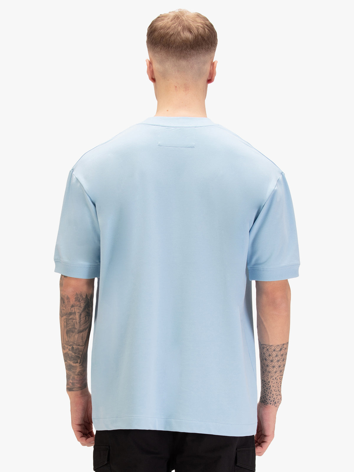 Men's relaxed-fit blue t-shirt with crew neck and short sleeves, worn by a model, back view