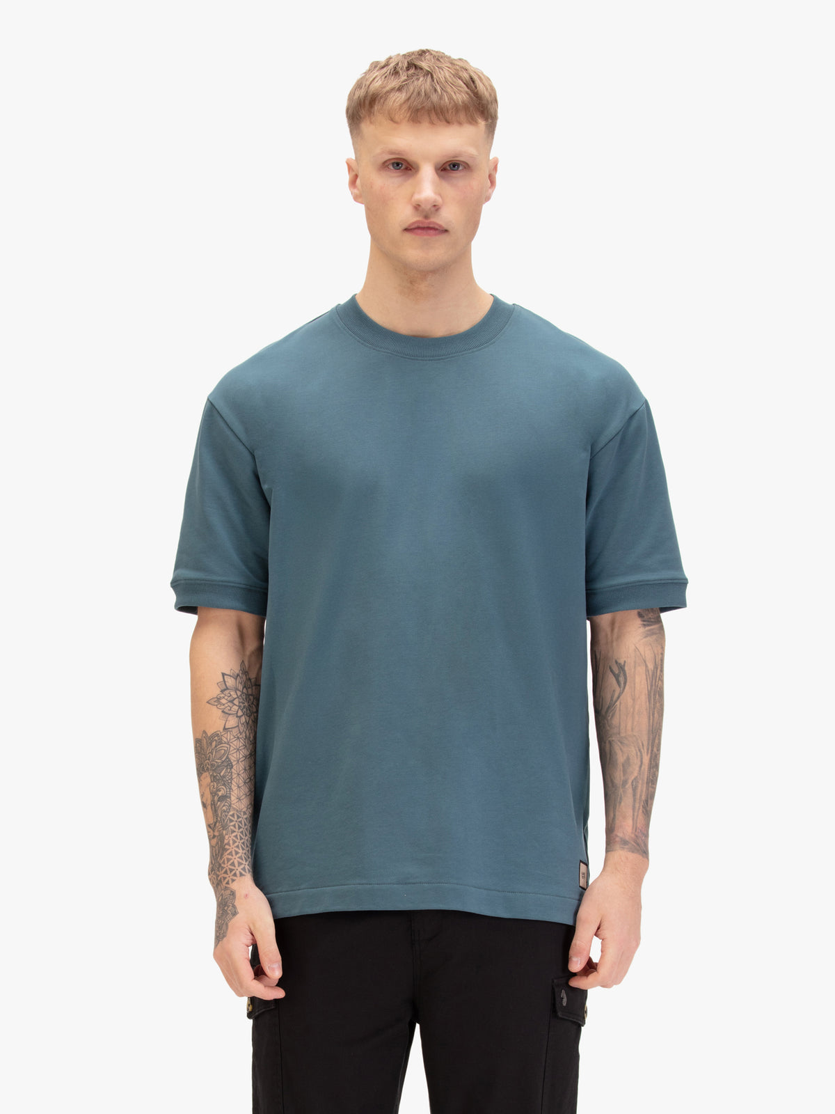 Men's relaxed-fit blue t-shirt with crew neck and short sleeves, worn by a model, front view