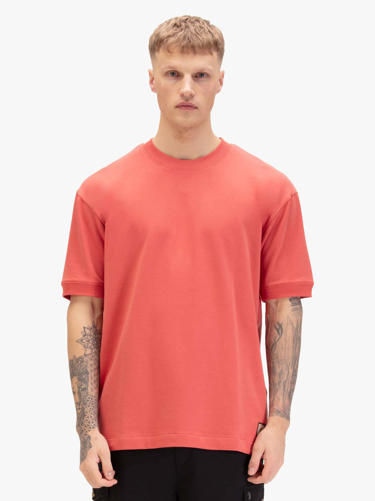 Men's relaxed-fit red t-shirt with crew neck and short sleeves, worn by a model, front view