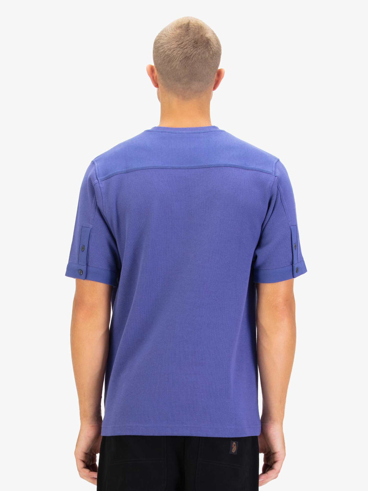 Men's purple t-shirt with crew neck and short sleeves worn by a model - back view.