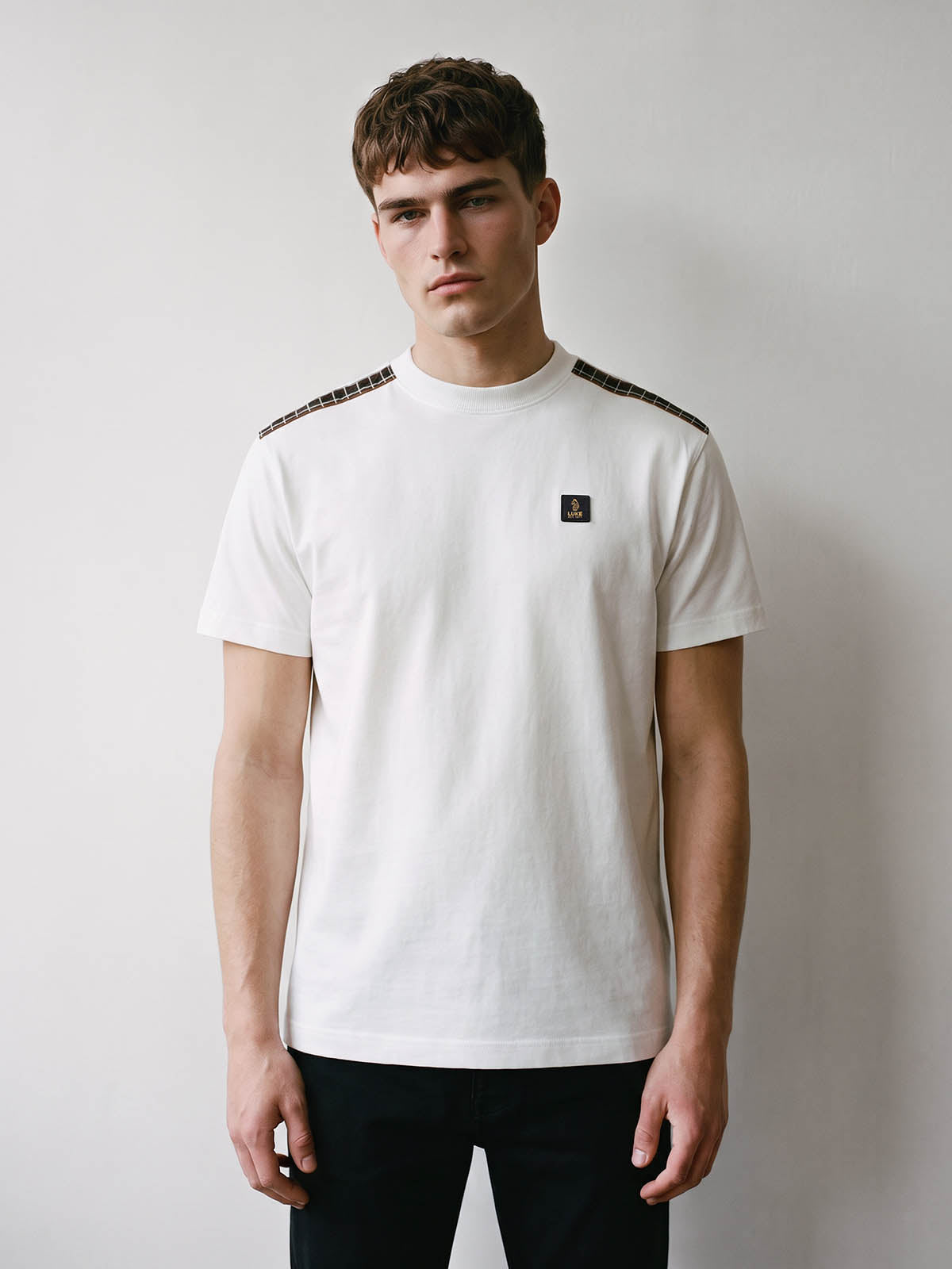 Man wearing white LUKE 1977 Glen relaxed fit t-shirt with check shoulders, front view