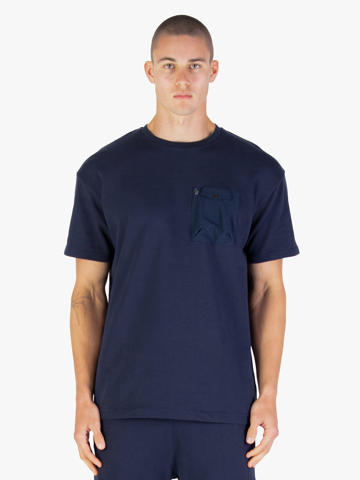 Men's navy t-shirt with crew neck and short sleeves worn by a model - front view.