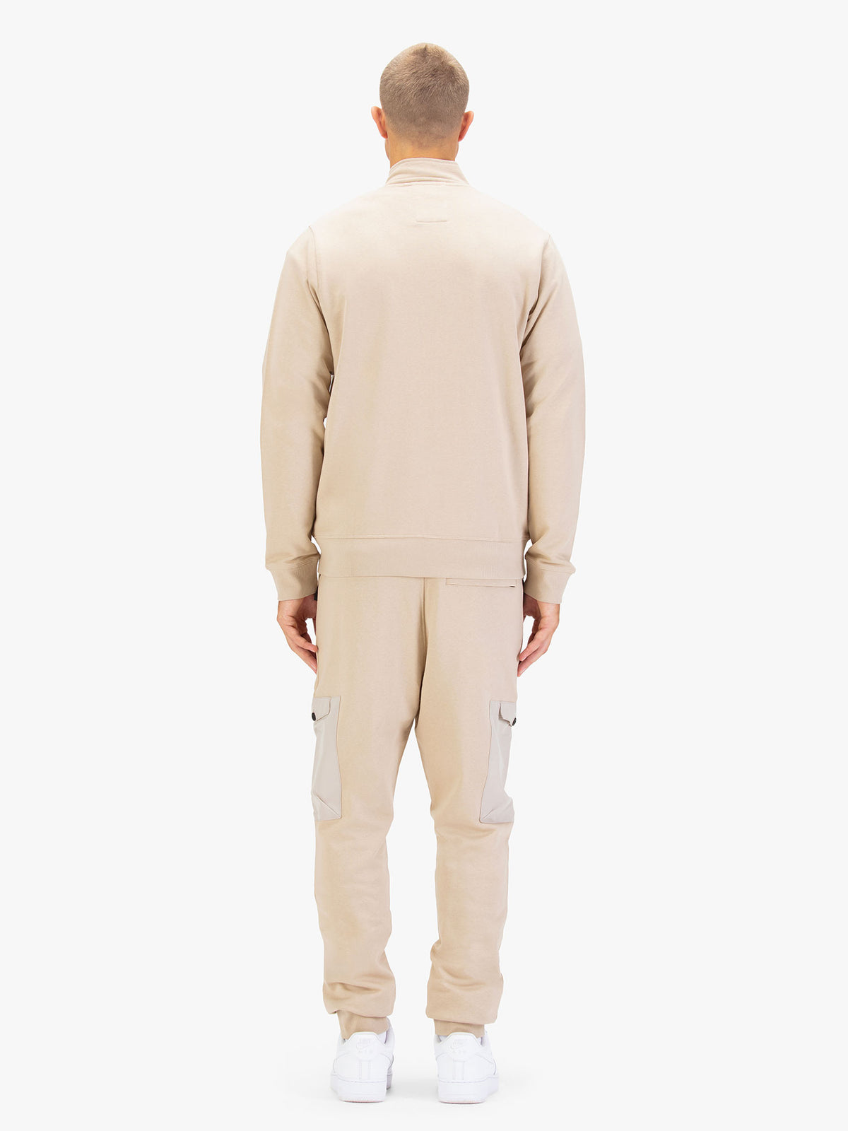 Men's beige tracksuit with sweatshirt and matching joggers.