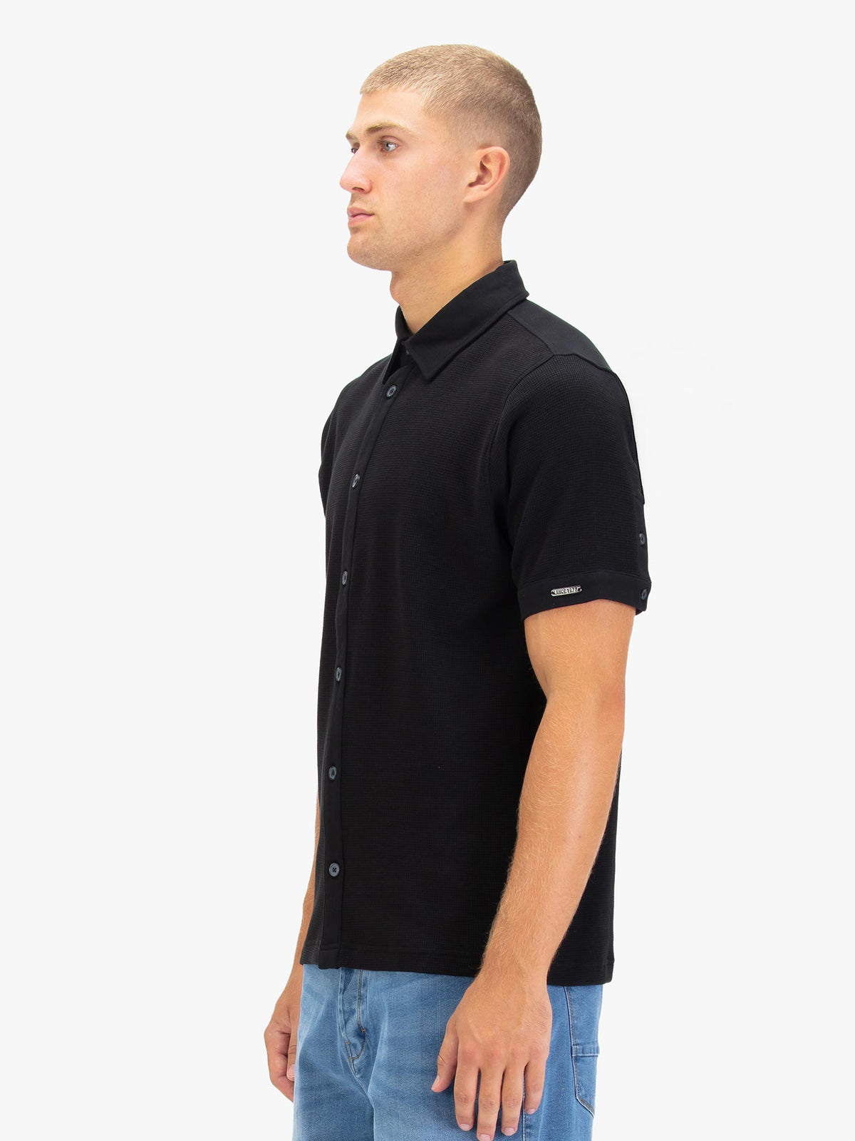 Men's black polo shirt with polo collar.