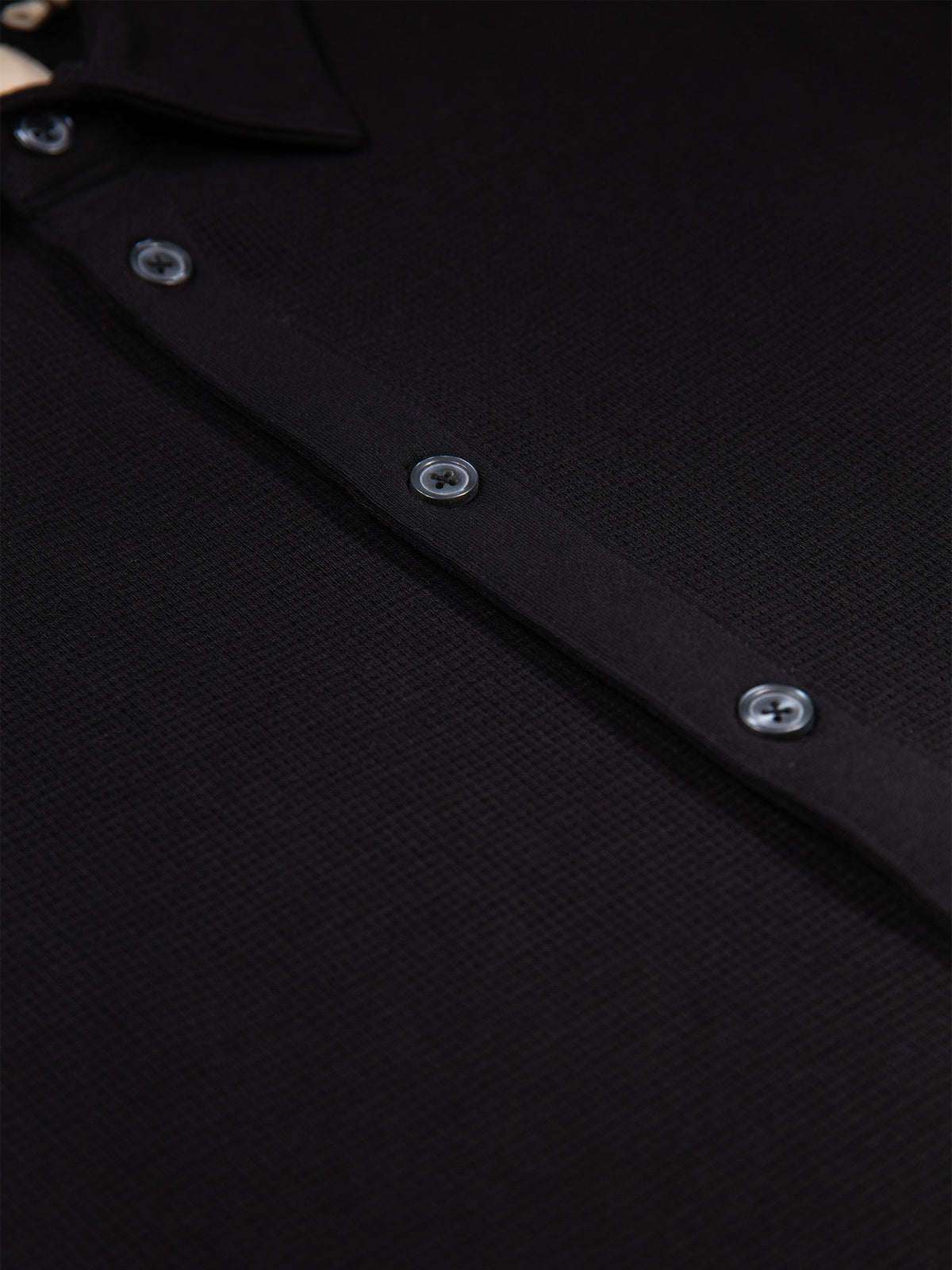 Men's black polo shirt with polo collar.