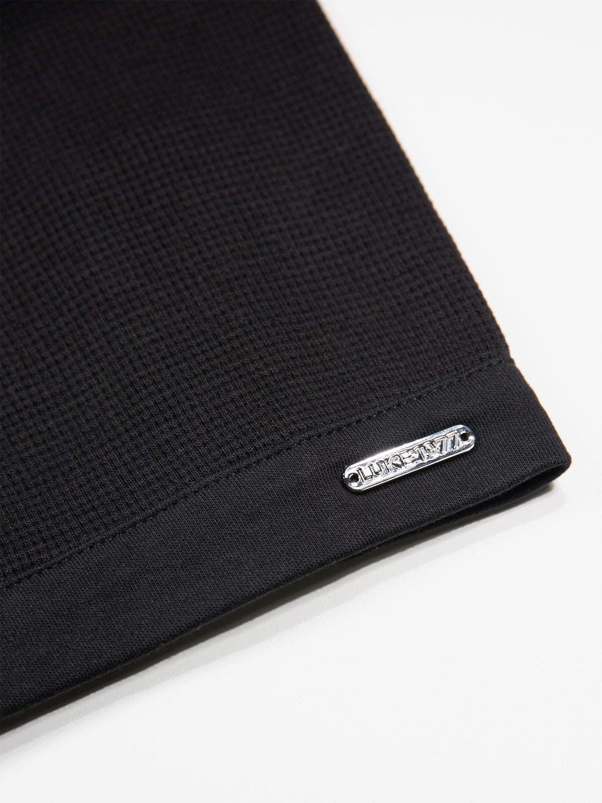 Men's black polo shirt with polo collar.