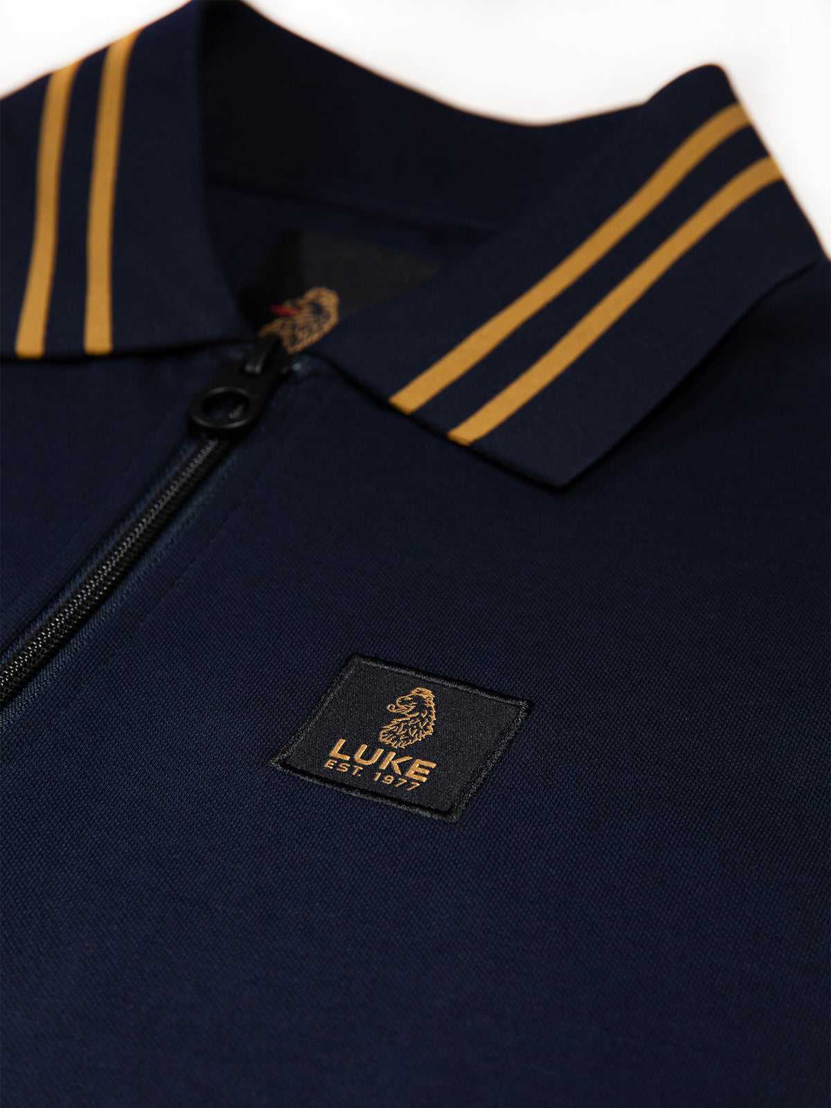 Men's navy polo shirt with polo collar.