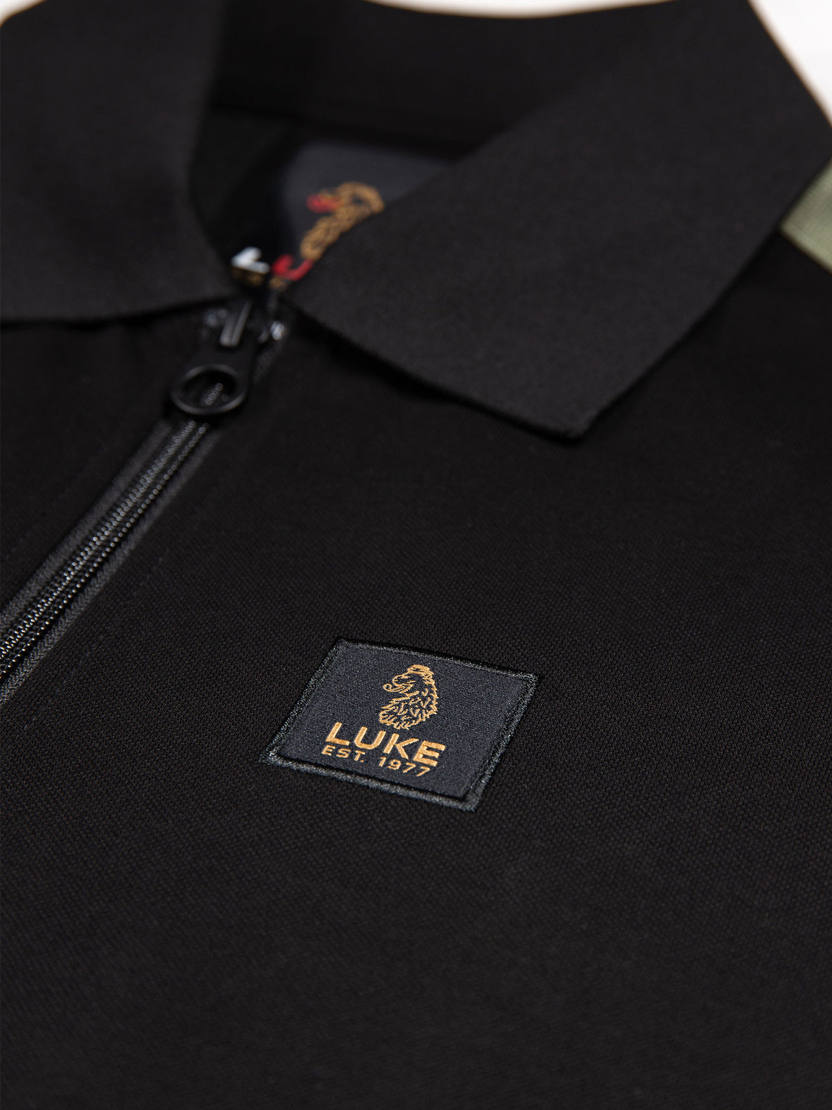 Men's black polo shirt with polo collar.