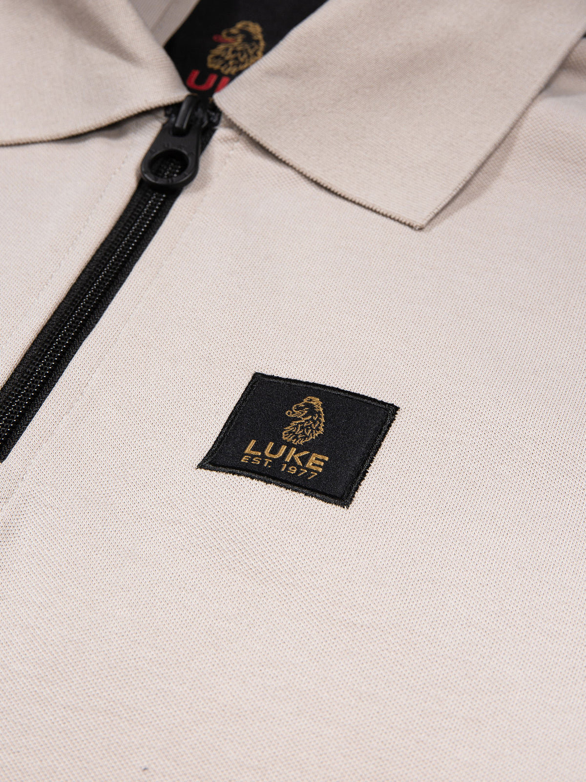 Men's grey polo shirt with polo collar.