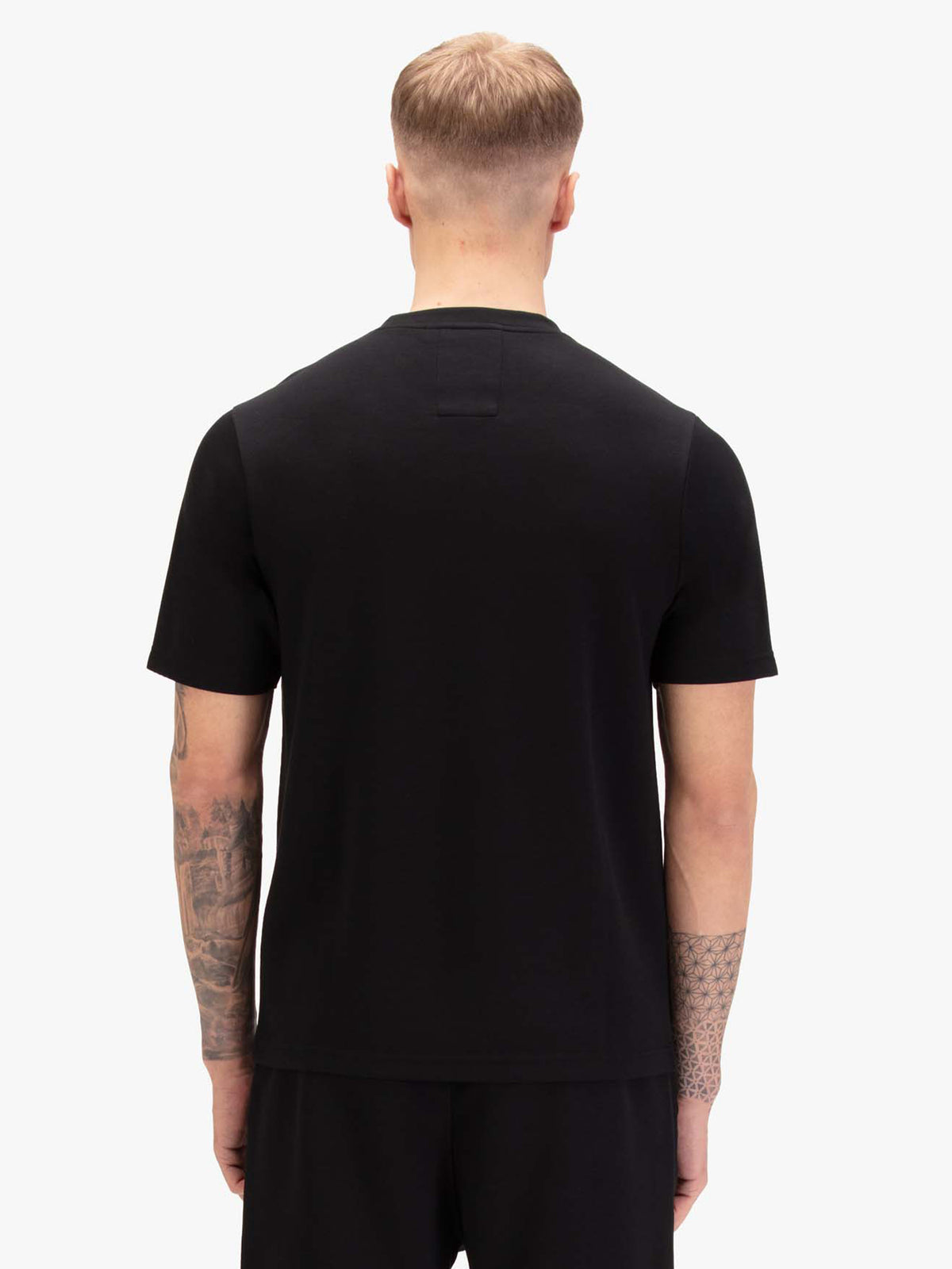Men's black t-shirt with crew neck and short sleeves, worn by a model, back view