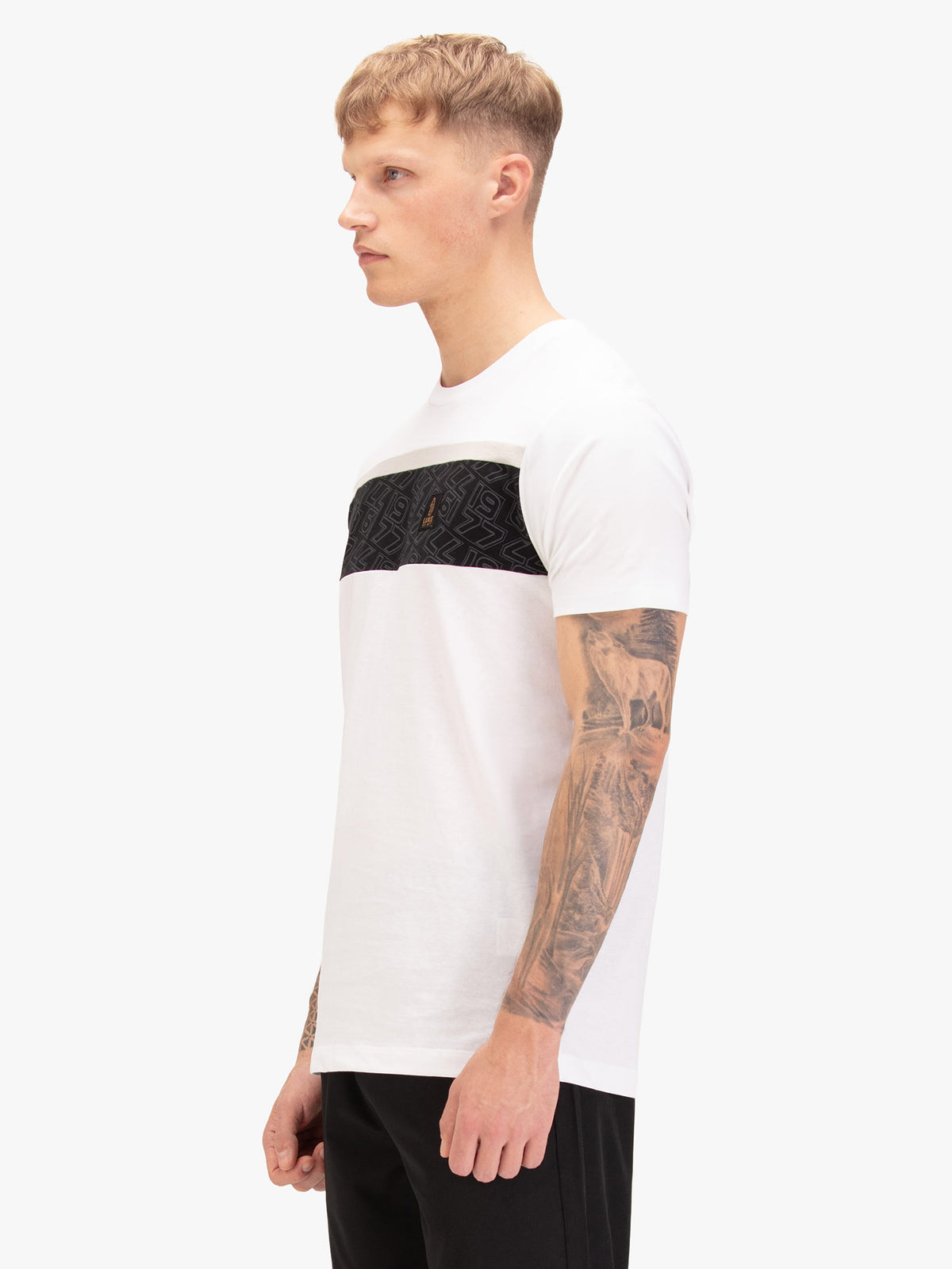 Men's white t-shirt with crew neck and short sleeves, worn by a model, side view