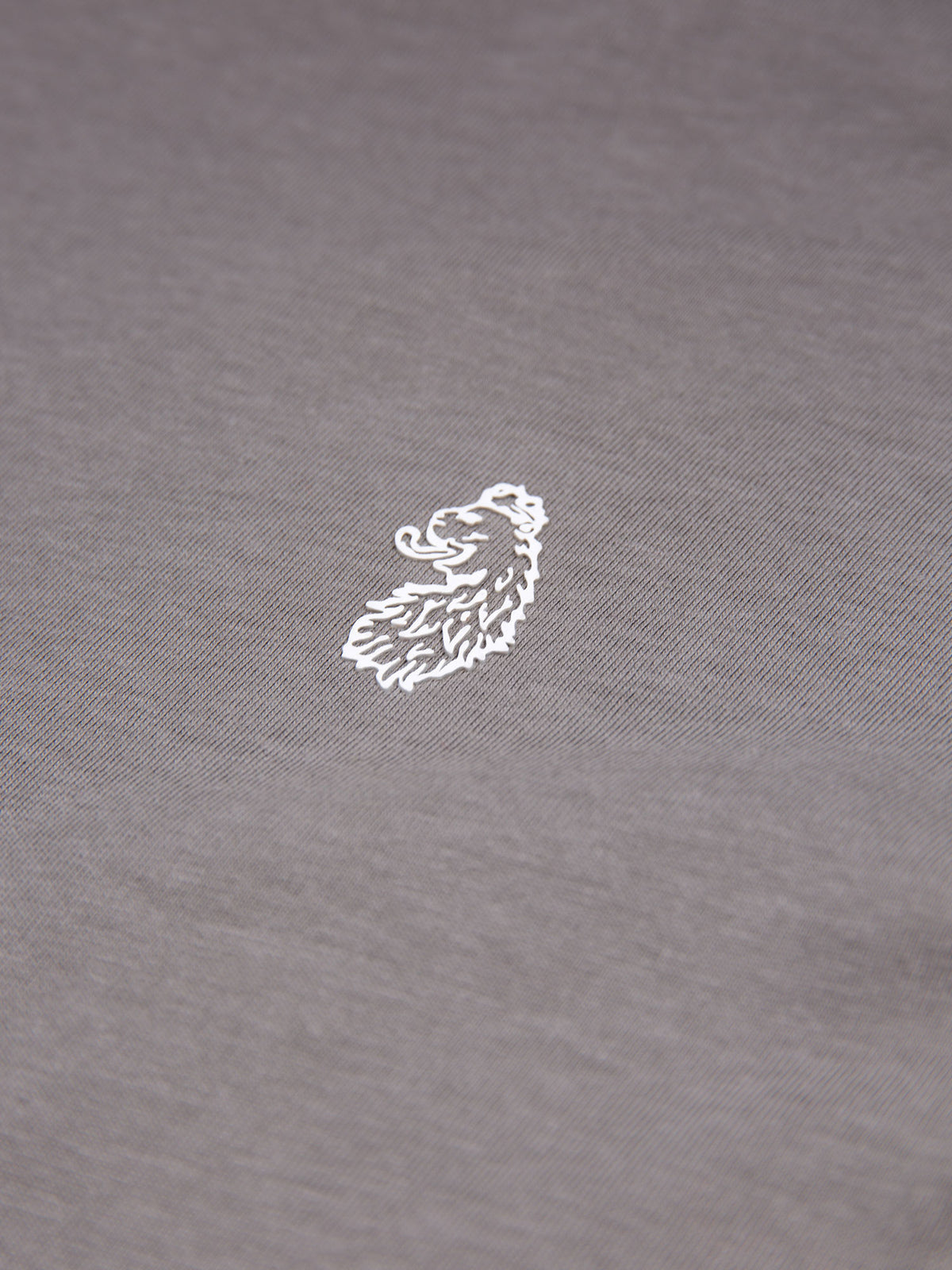 Men's grey long sleeved t-shirt - detail view of lion motif.
