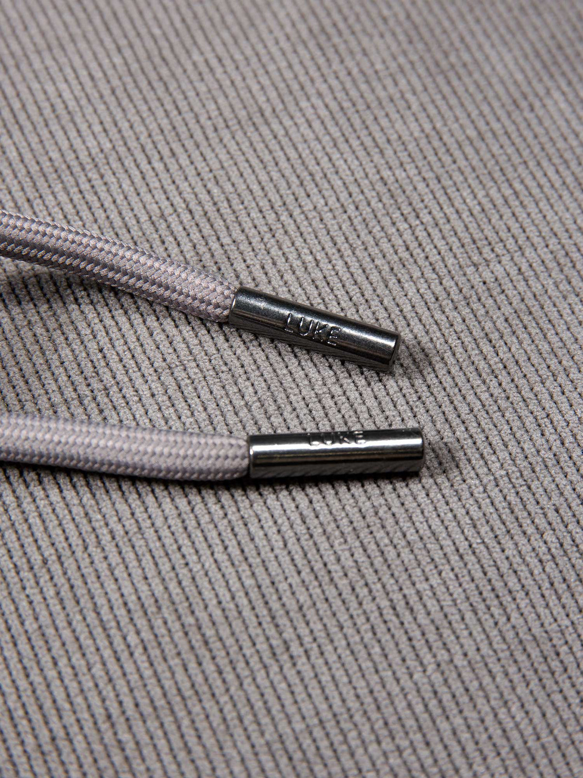 Men's relaxed-fit grey hoodie with front pocket and drawstring hood, detail view 2