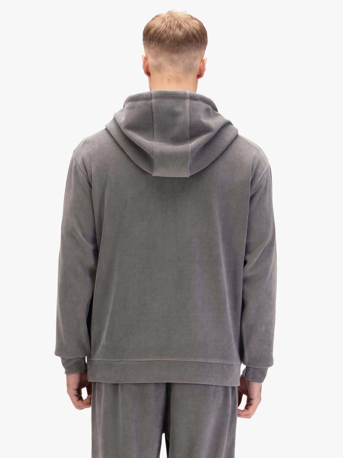 Men's relaxed-fit grey hoodie with front pocket and drawstring hood, worn by a model, back view