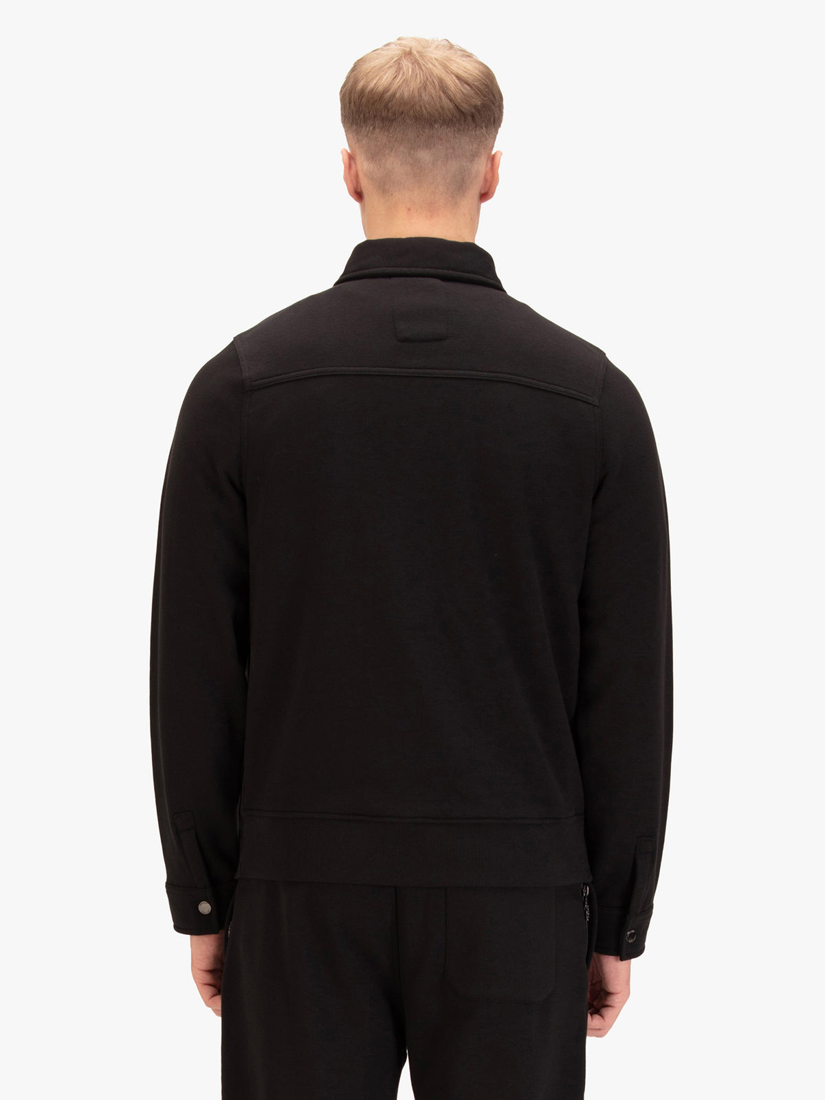 Men's slim-fit black sweatshirt with quarter-zip neck and chest pocket, detail view 1
