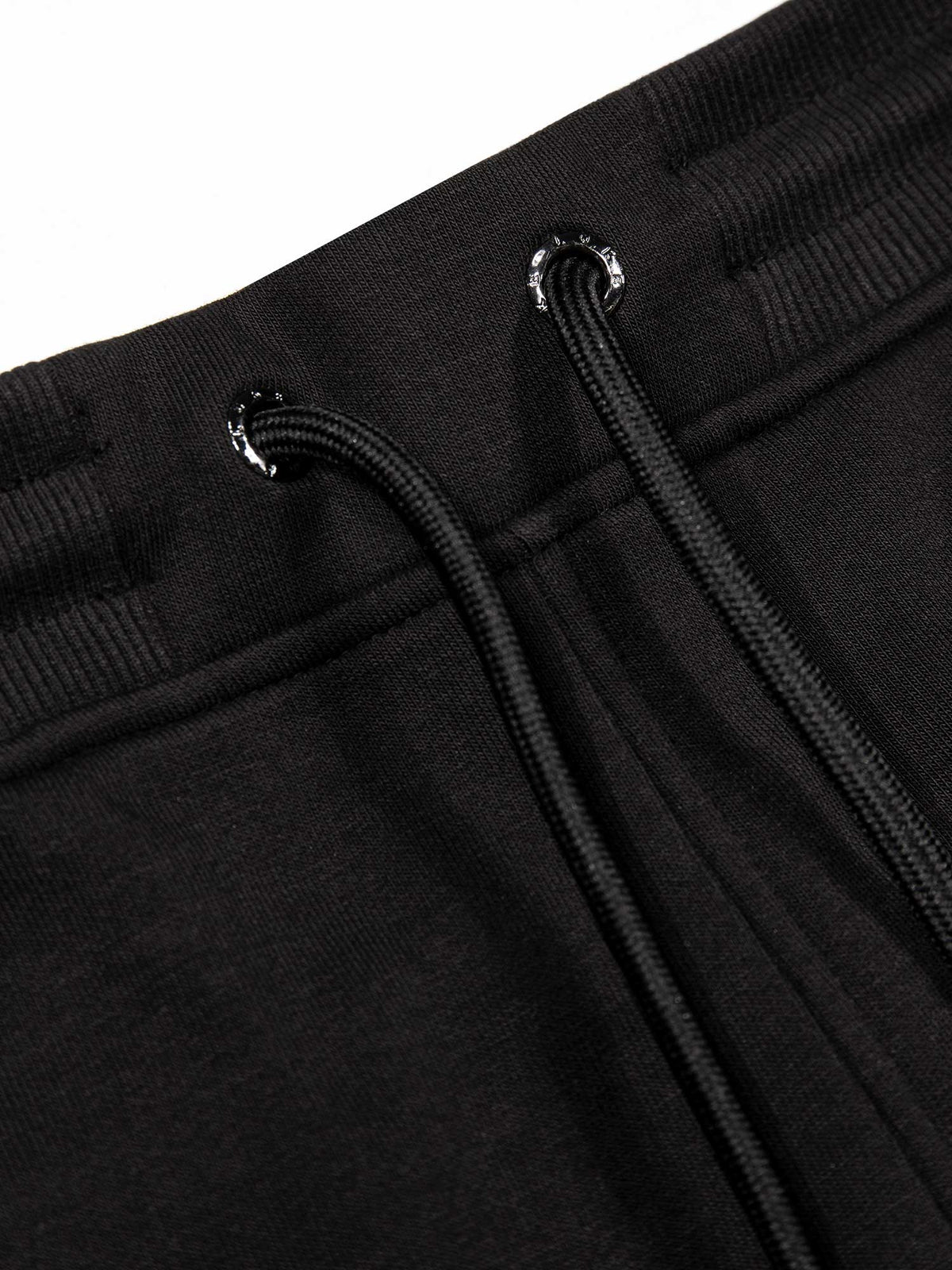 Men's wide-leg black joggers with drawstring waistband, detail view 1