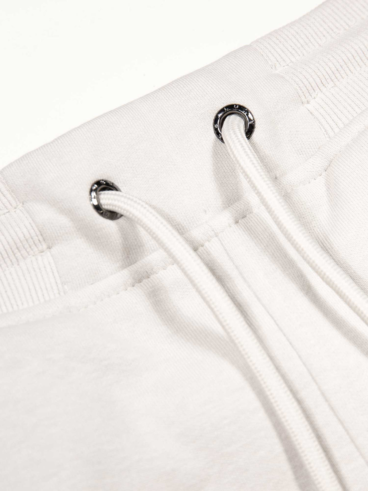 Men's wide-leg grey joggers with drawstring waistband, detail view 1