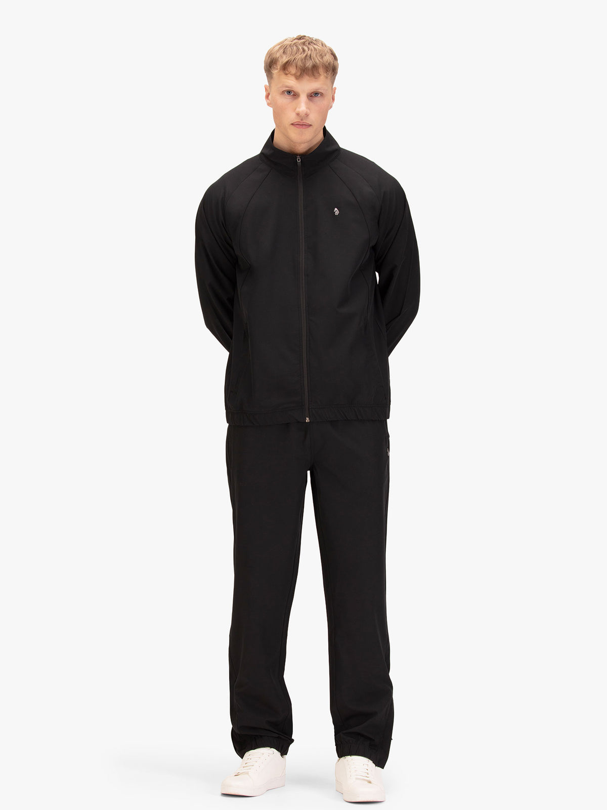 Man wearing black LUKE 1977 Moseley lightweight tracksuit, front view